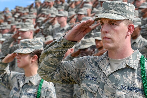 Airmen in Training from Sheppard Air Force Base, Texas, salute during the playing of the National Anthem during the Prisoners of War and Missing in Action parade at Sheppard Air Force Base, Texas. Sept. 18, 2015. More than 83,000 Americans from World War I all the way through the Gulf War are still considered missing in action. (U.S. Air Force photo/Senior Airman Kyle Gese)