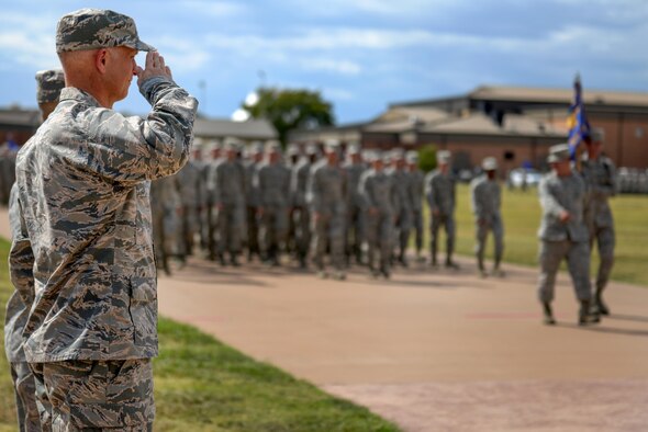 Col. Timothy Gillaspie, 82nd Training Wing vice commander, salutes a squadron of Airmen passing by during the Prisoners of War and Missing in Action parade at Sheppard Air Force Base, Texas. Sept. 18, 2015. More than 83,000 Americans from World War I all the way through the Gulf War are still considered missing in action. (U.S. Air Force photo/Senior Airman Kyle Gese)