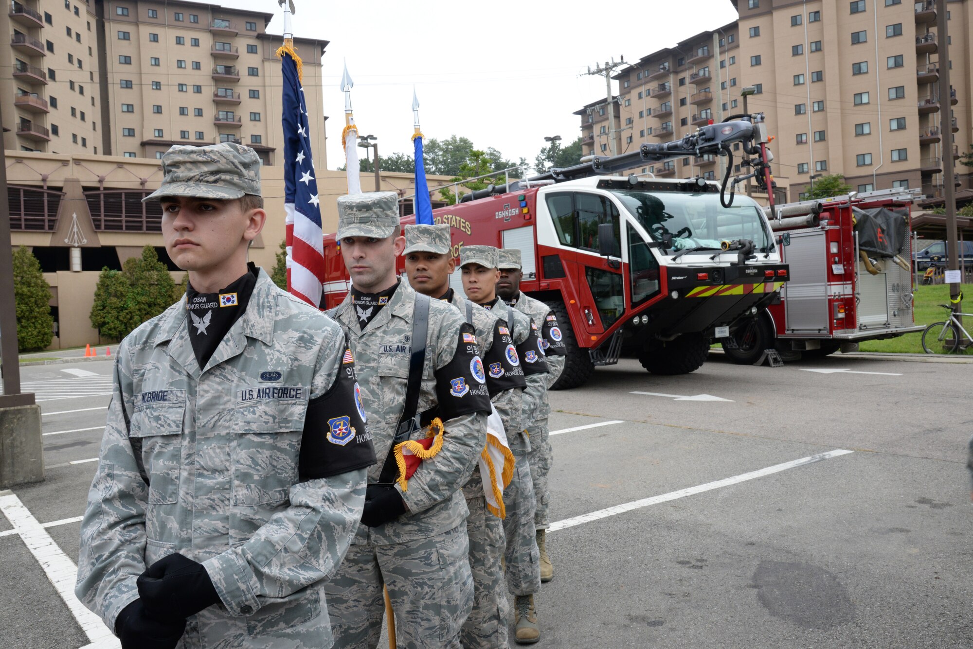 Members of the Osan Honor Guard stand ready before the start of the 9/11 remembrance ceremony Sept. 11, 2015, at Osan Air Base, Republic of Korea. Osan Airmen paid tribute to the 2,977 innocent lives that were taken Sept. 11, 2001, by climbing 110 flights of stairs, making a silent movement to the ceremony site and concluded with a wreath-laying ceremony.  (U.S. Air Force photo/Tech. Sgt. Travis Edwards)