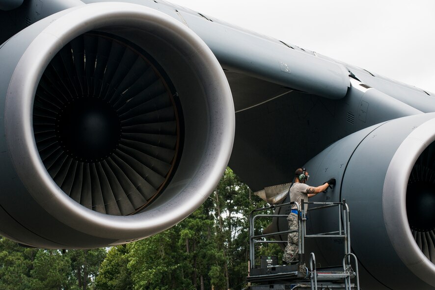 A maintenance Airman performs post-flight maintenance on a C-5M Super Galaxy Sept. 16, 2015, at Moody Air Force Base, Ga. The C-5M  was utilized as a large-capacity aircraft to transport cargo to support Team Moody’s six-month deployment to northwest Europe. (U.S. Air Force photo by Airman 1st Class Dillian Bamman/Released)