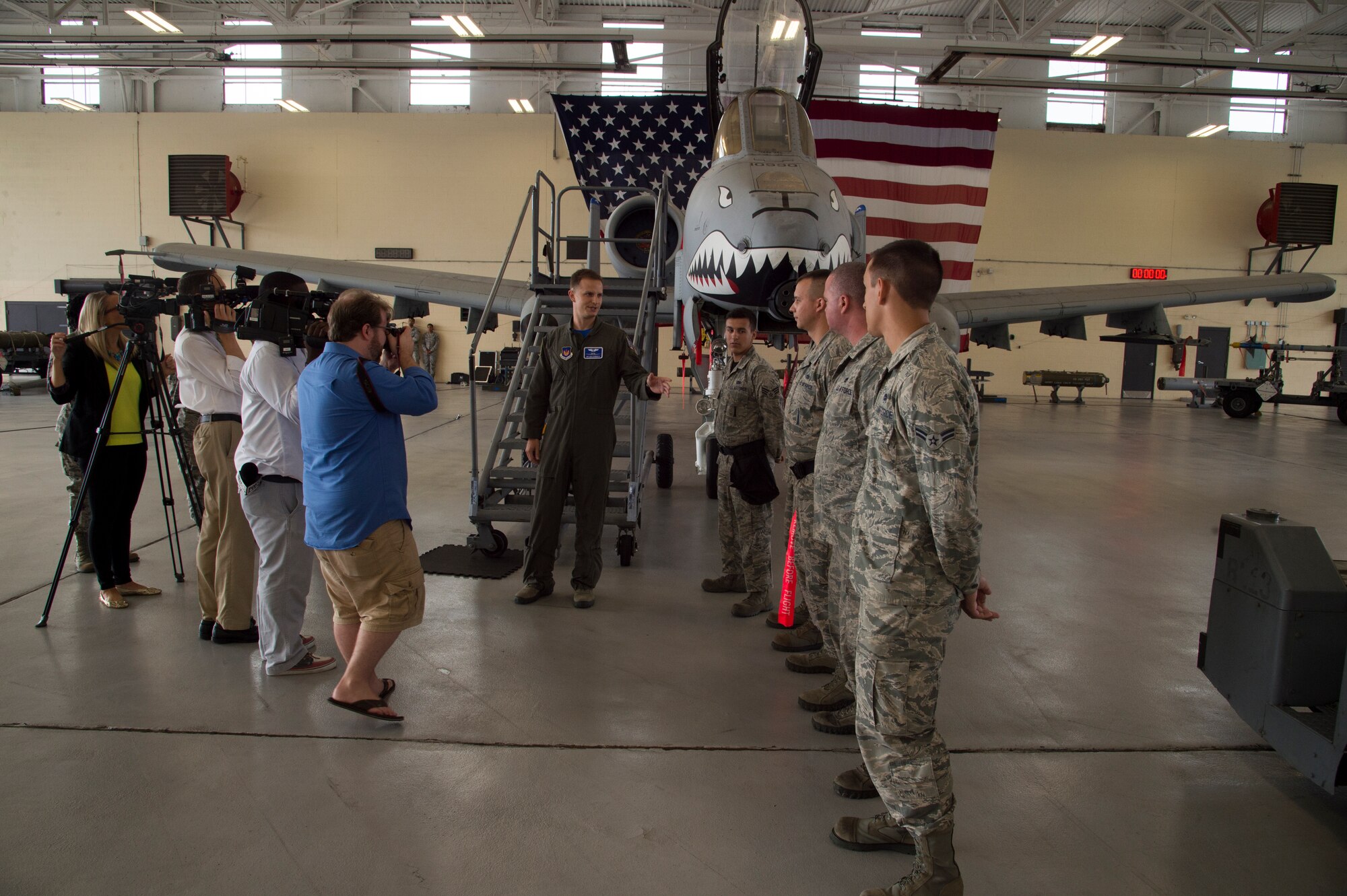 U.S. Air Force Capt. Stewart Cornett, 74th Fighter Squadron A-10C Thunderbolt II pilot, explains to local reporters the jobs of maintenance Airmen that work on the A-10 during the 74th FS media day, Sept. 18, 2015, at Moody Air Force Base, Ga. Twelve A-10s are slated to deploy to Europe as part of a Theater Security Package, which refers to the rotational deployment of additional air force assets, support personnel and equipment to bolster U.S. forces in Europe. (U.S. Air Force photo/Staff Sgt. Eric Summers Jr./Released)