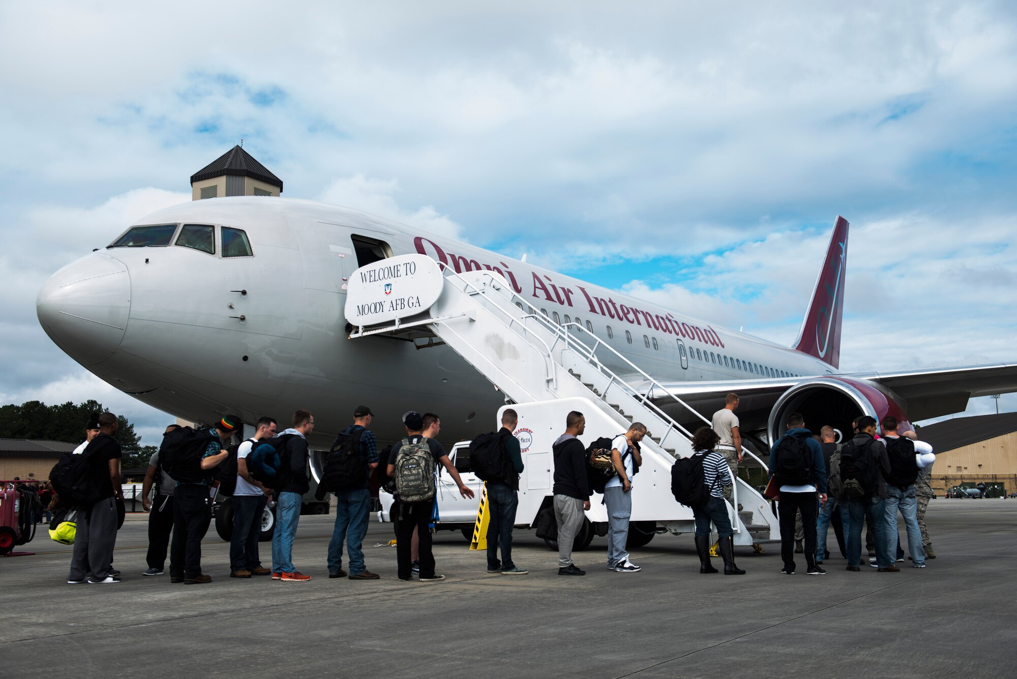 Airmen from the 23d Wing board a Boeing 767 as they prepare to deploy Sept. 17, 2015, at Moody Air Force Base, Ga.  More than 150 Airmen from the 23d Wing set off for a six-month deployment to northwest Europe. (U.S. Air Force photo by Airman 1st Class Dillian Bamman/Released)
