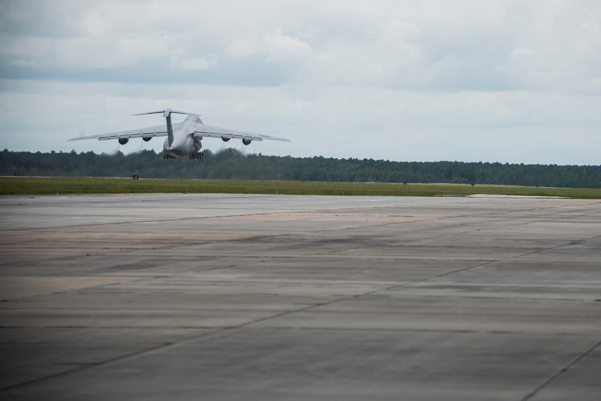 A C-5M Super Galaxy takes off for the South Georgia skies Sept. 16, 2015, at Moody Air Force Base, Ga. The C-5M transported cargo for Team Moody’s six-month deployment to northwest Europe in support of Operation Atlantic Resolve. Operation Atlantic Resolve is a demonstration of the U.S. Air Force’s dedication to the enduring peace and stability of Europe. (U.S. Air Force photo by Airman 1st Class Dillian Bamman/Released)