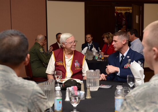 Retired U.S. Army Sgt. 1st Class Obie Wickersham (left), World War II veteran and Korean War POW, sits and speaks with Beale Airmen during a National POW/MIA Recognition Day event at Beale Air Force Base, California, Sept. 18, 2015. Wickersham was captive for 28 months after Chinese forces overran his platoon May 17, 1951. (U.S. Air Force photo by Chandresh Bhakta)