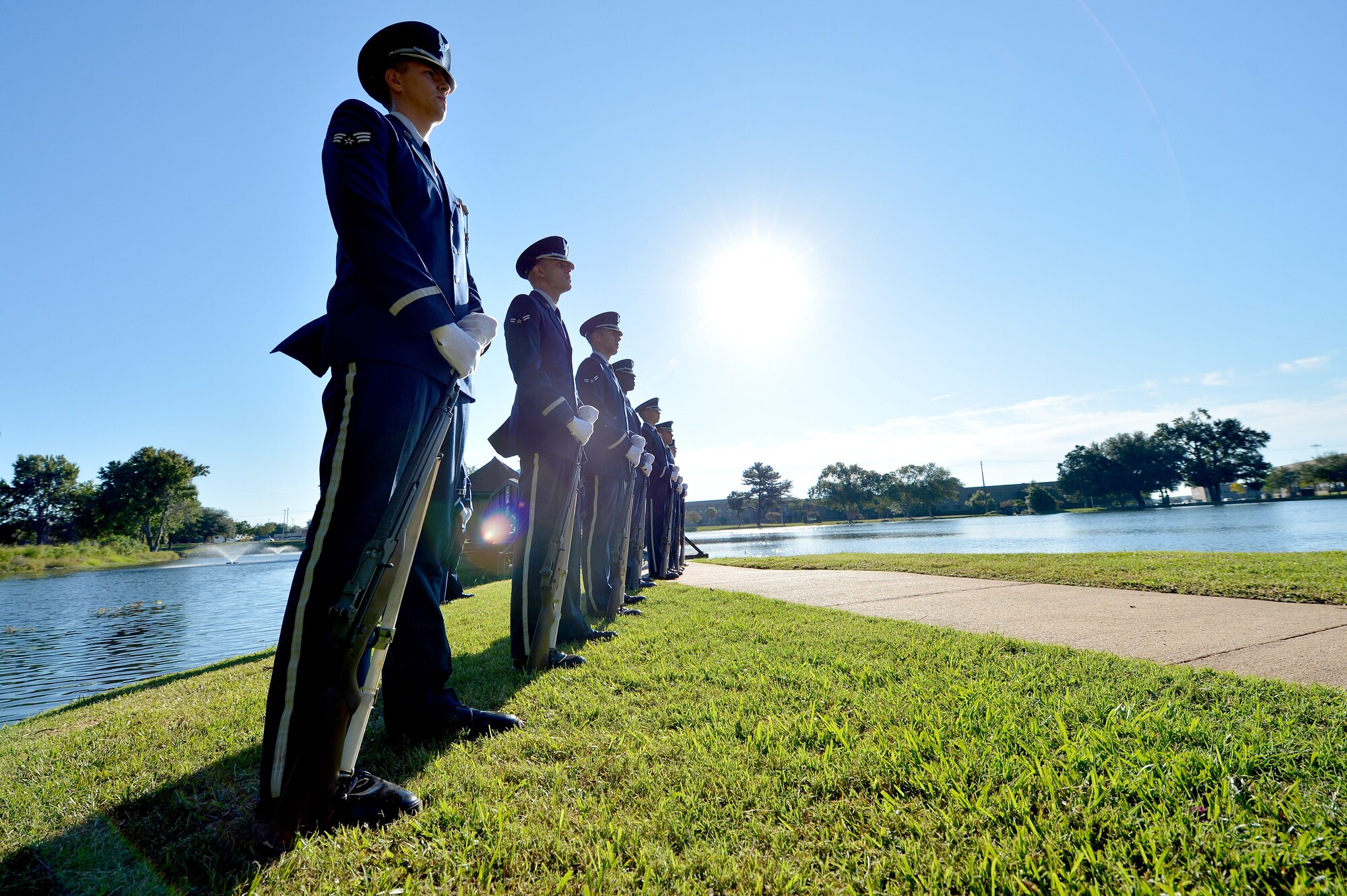Airmen from the 20th Force Support Squadron Honor Guard stand in formation during a POW/MIA Remembrance Day ceremony at Shaw Air Force Base, S.C., Sept. 18, 2015. The Honor Guardsmen provided the presentation of colors, a firing volley, and taps for the ceremony. (U.S. Air Force photo by Senior Airman Diana M. Cossaboom/Released)