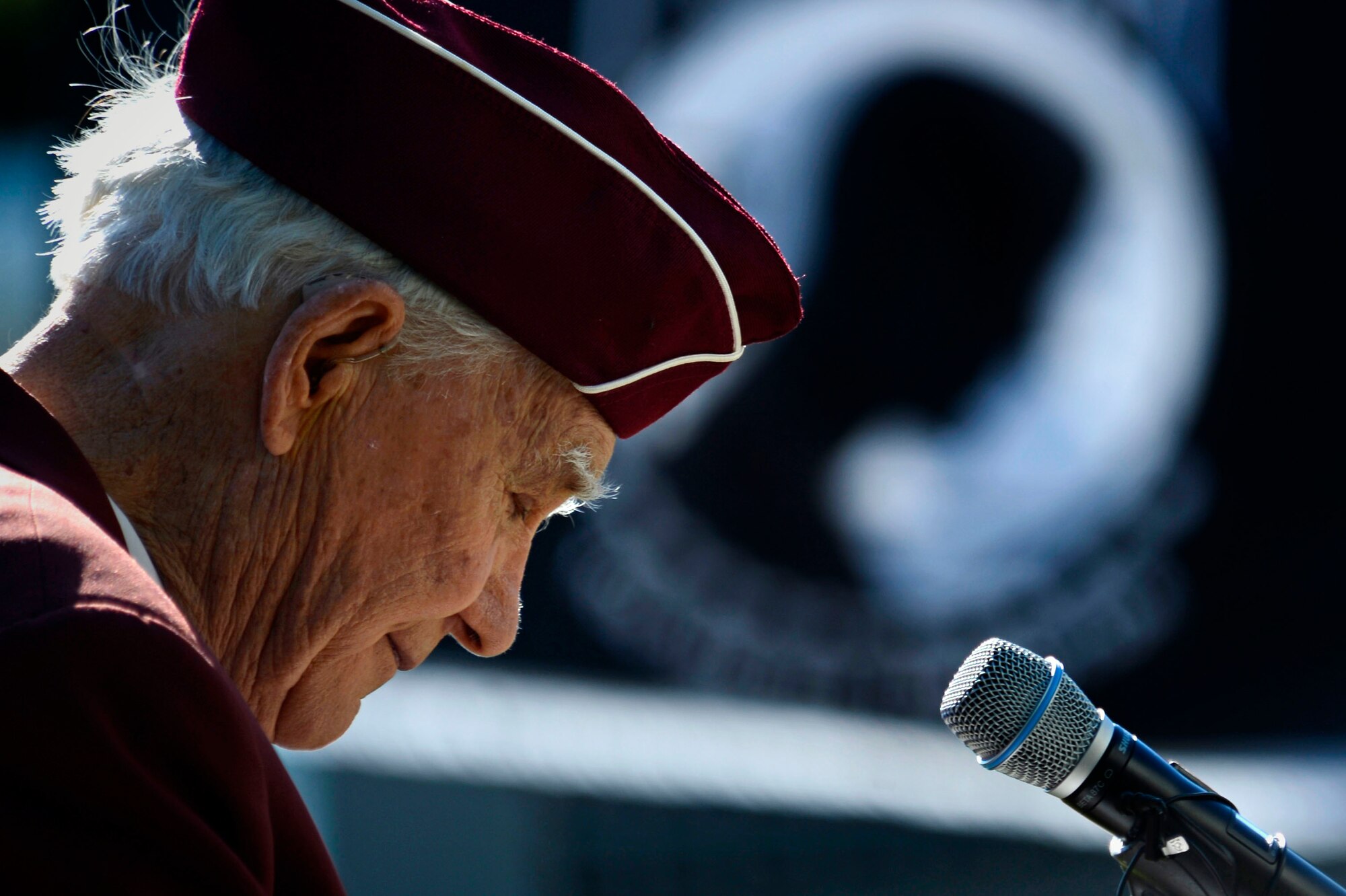 William Pebley, a former prisoner of war, takes a moment to pause while giving a speech during a POW/MIA ceremony at Shaw Air Force Base, S.C., Sept. 18, 2015. Pebley spoke about a close friend who went missing in action during WWII.  (U.S. Air Force photo by Senior Airman Jensen Stidham/Released)