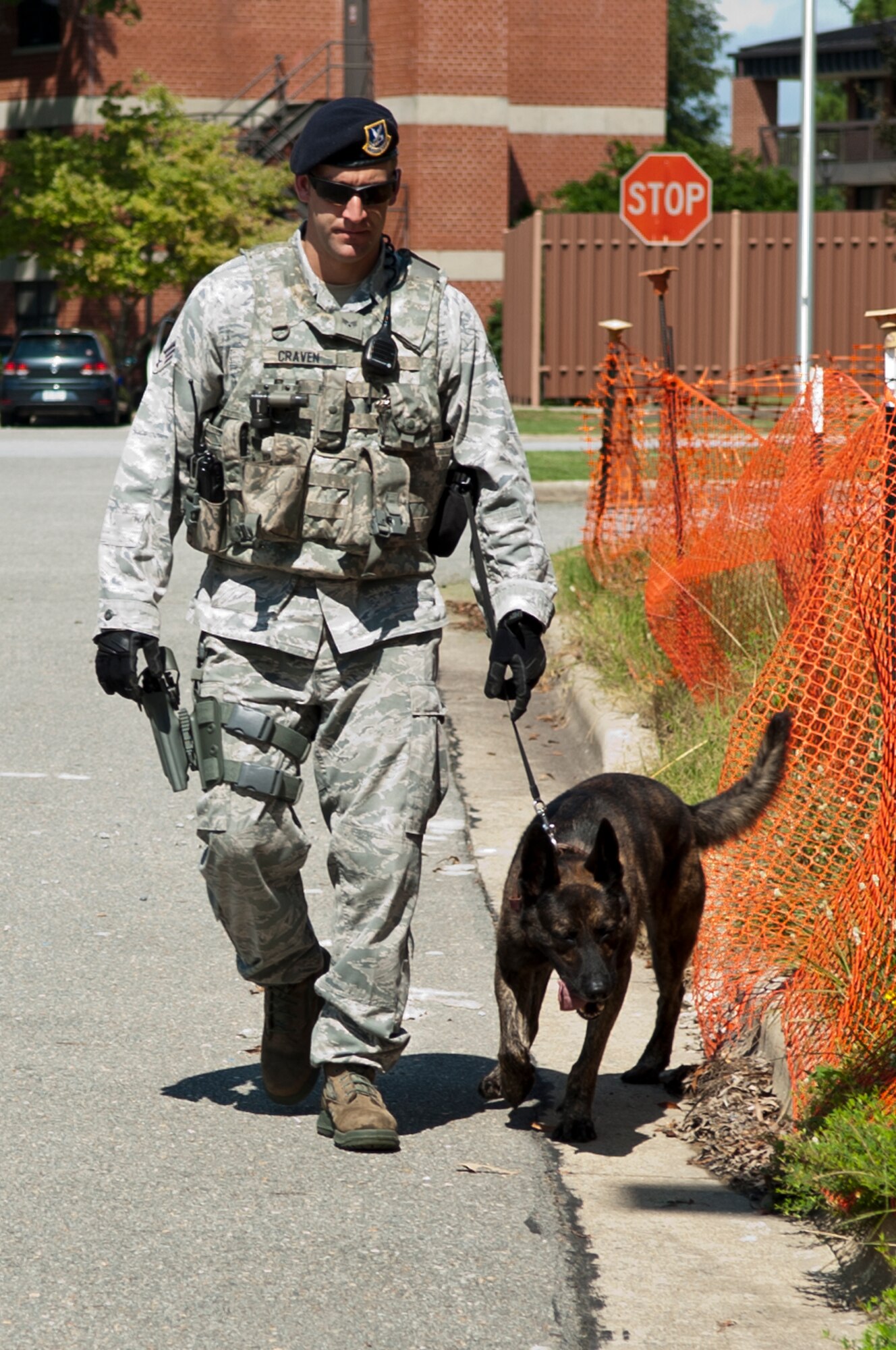 Senior Airman Austin Craven, 4th Security Forces Squadron military working dog handler, performs a building sweep with MWD Ronni, Sept. 8, 2015, at Seymour Johnson Air Force Base, North Carolina. Along with patrols, Craven and Ronni are tasked with performing random building sweeps throughout the base during their shift. (U.S. Air Force photo/Airman 1st Class Shawna L. Keyes)