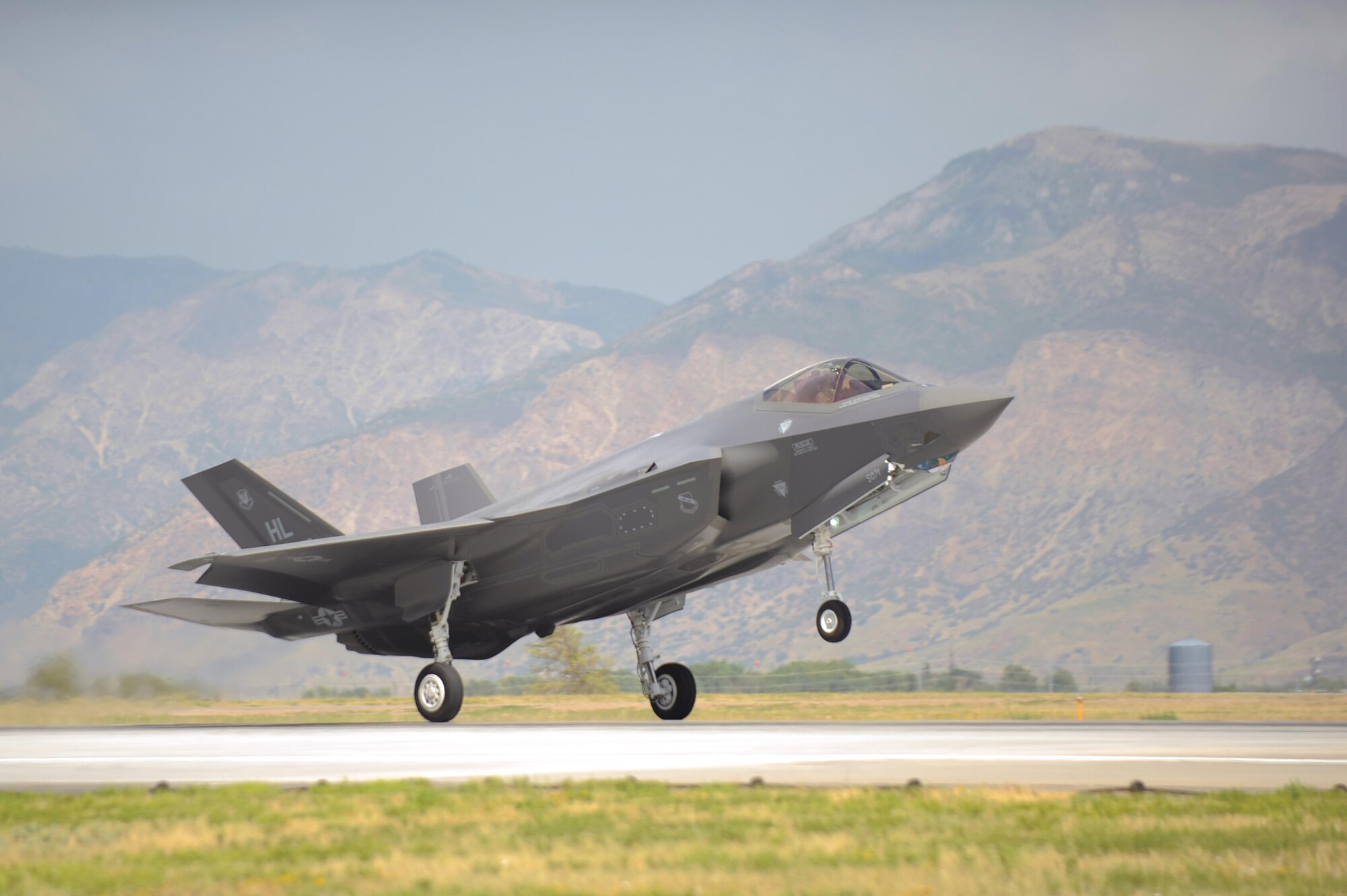 An F-35A Lightning II aircraft piloted by Col. David Lyons, the 388th Fighter Wing commander, touches down at Hill Air Force Base, Utah, Sept. 2, 2015. This and another fighter jet piloted by Lt. Col. Yosef Morris, the 34th Fighter Squadron director of operations, were the first two operational F-35s received at the base. The rest of the fleet of up to 72 F-35s are slated to arrive on a staggered basis through 2019. (U.S. Air Force photo/Todd Cromar)
