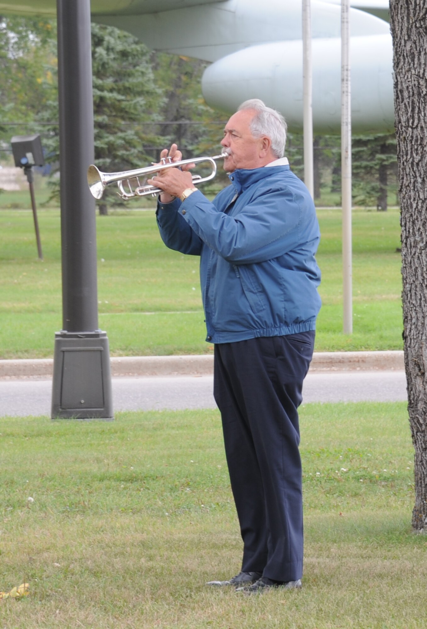 Einar Einarson plays taps to conclude the POW/MIA ceremony at Grand Forks Air Force Base, North Dakota, Sept. 17, 2015. The president signs a proclamation every year marking the third Friday in September as the National POW/MIA Recognition Day. (U.S. Air Force photo by Senior Airman Desiree Economides/Released)