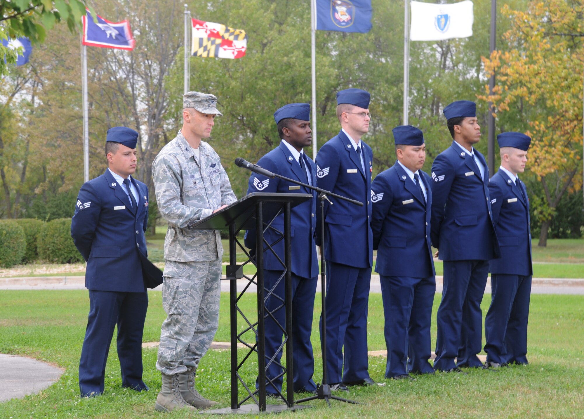 Col. Robert Cook, 319th Air Base Wing vice commander, provides remarks during a POW/MIA ceremony at Grand Forks Air Force Base, North Dakota, Sept. 17, 2015. During his speech, Cook talked briefly about the history of POW/MIA Remembrance Day and how the flag came to be. (U.S. Air Force photo by Senior Airman Desiree Economides/Released)