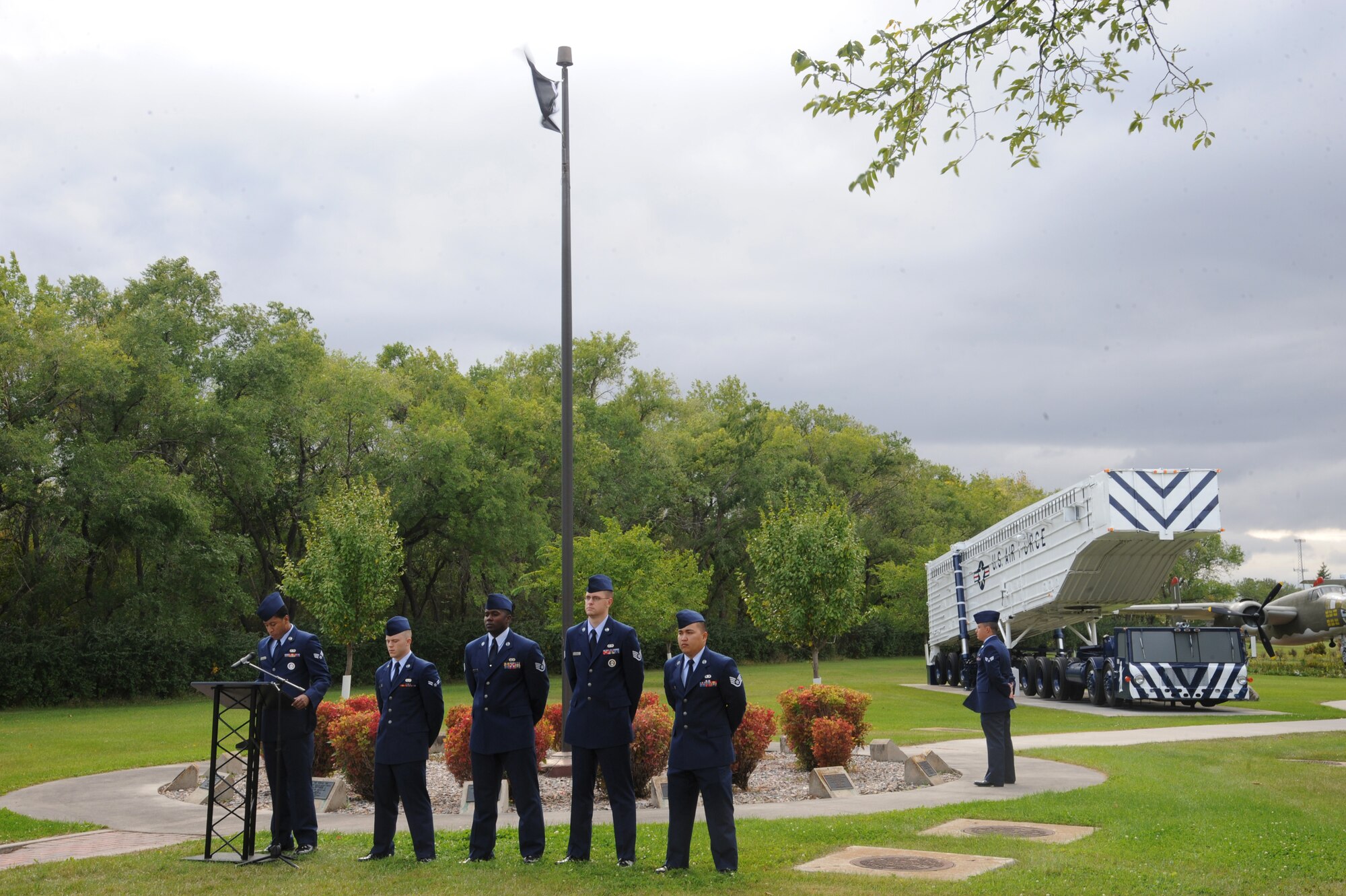 Airmen from Grand Forks Air Force Base, North Dakota, gather at the Freedom Tree Memorial Sept. 17, 2015, for a ceremony honoring POW/MIAs. The ceremony hosted by the 319th Air Base Wing was put together by the Air Force Sergeant's Association Chapter 964. (U.S. Air Force photo by Senior Airman Desiree Economides/Released)