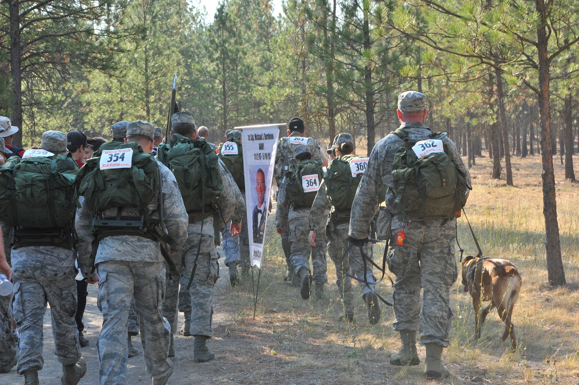 Members from the 92nd Security Forces Squadron participate in a nine-mile ruck hike at the March for the Fallen event Sept. 12, 2015, in Northwest Spokane, Wash. Various other Team Fairchild and local community members participated in the race and  proceeds raised were donated to local Veterans groups throughout Washington State.  The main event of March for the Fallen was a non-competitive march/walk to honor the fallen that will be open to everyone. (U.S. Air Force photo/Staff Sgt. Veronica Montes)