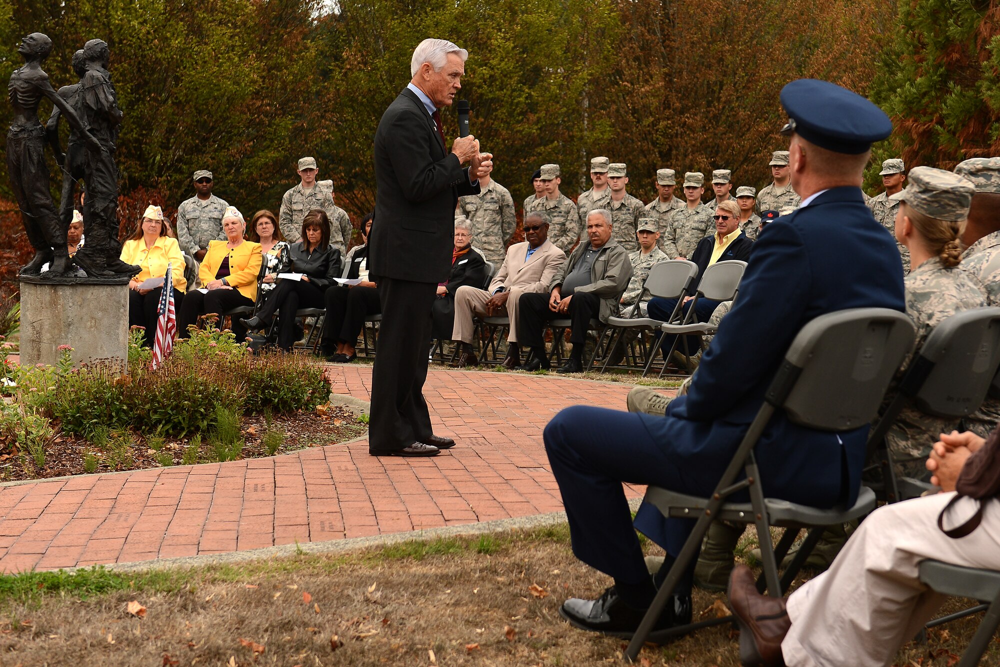 Retired Lt. Col. Barry Bridger, former prisoner of war, gives a speech, Sept. 16, 2015, at Joint Base Lewis-McChord, Wash., during the POW/MIA week. Bridger spoke to more than 120 attendees that included members of JBLM, local community members and several members of the Gold Star Wives organization. (U.S Air Force photo/Staff Sgt. Tim Chacon) 