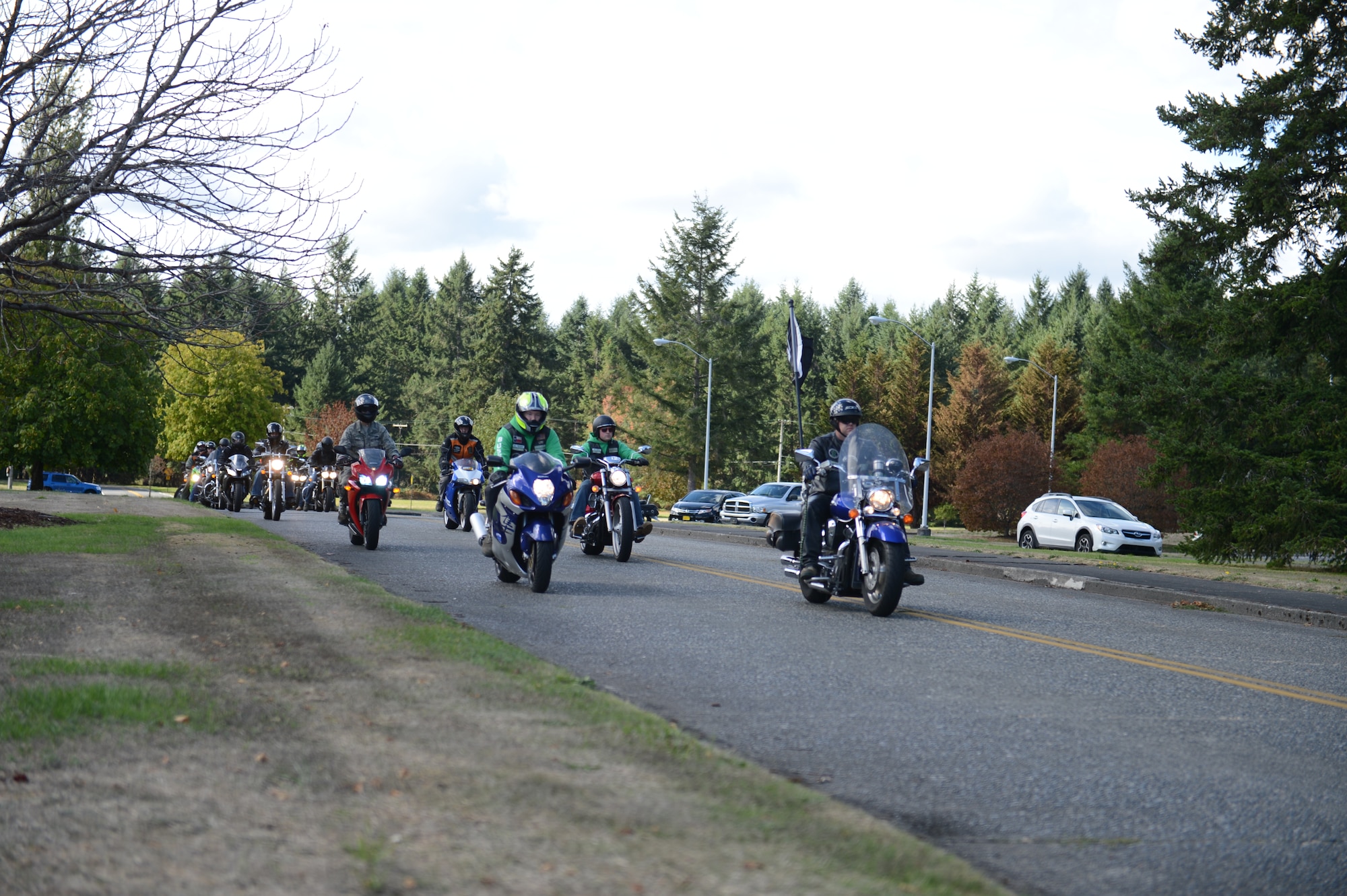 Members of the Green Knights Military Motorcycle Club Chapter 3 and other McChord Airmen who ride motorcycles depart from the McChord Field Collocated Club, Joint Base Lewis-McChord, Wash., for their ride to the Washington Soldier’s Home Orting in Puyallup, Wash., as part of the 2015 POW/MIA Remembrance Week, Sept. 16, 2015. The Washington Soldier’s Home Orting provides 24-hour medical care, as well as other support services such as physical therapy, volunteer programs, religious programs, transportation, and patriotic internment services. (U.S. Air Force photo/Staff Sgt. Katie Jackson)