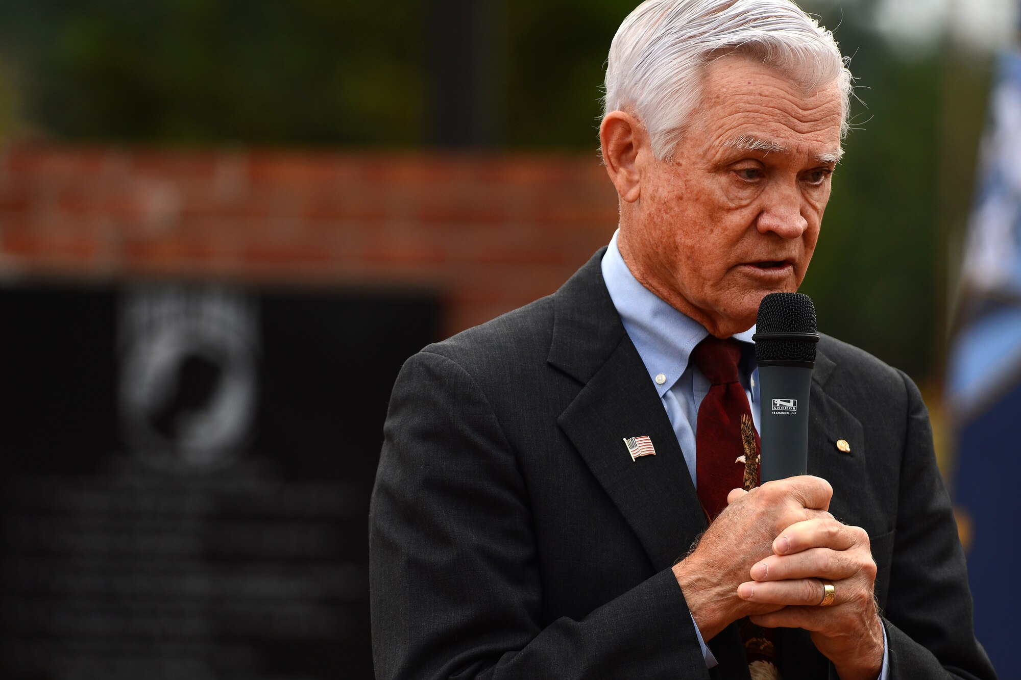 Retired Lt. Col. Barry Bridger, former prisoner of war, gives a speech, Sept.16, 2015, at Joint Base Lewis-McChord, Wash., during the POW and missing in action week. Bridger served 22 years in the Air Force, six of which he spent in the Vietnam prison camp, Hanoi-Hilton. (U.S Air Force photo/Staff Sgt. Tim Chacon)