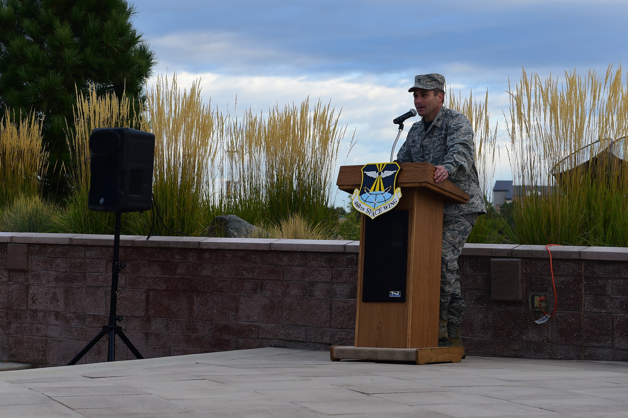 Col. John Wagner, 460th Space Wing commander, spoke during a POW/MIA ceremony Sept. 18, 2015, on Buckley Air Force Base, Colo. The ceremony recognized those who have had to endure enemy captivity and those who never made it back home after a conflict. The guest of honor, retired Tech. Sgt. Jasper Page, was a POW during the Vietnam War but escaped captivity and was able to make it back to American positions safely. (U.S. Air Force photo by Airman 1st Class Luke W. Nowakowski/Released)