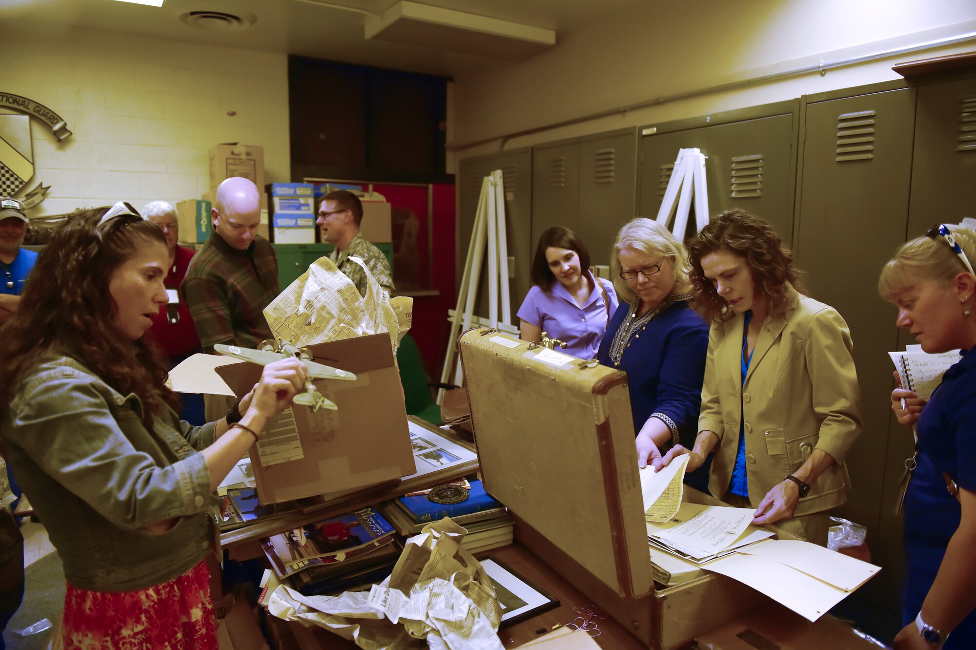 Preservationists from a variety of Colorado organizations admire artifacts found in Hangar 909 during a tour Sept. 14, 2015, on Buckley Air Force Base, Colo. Hangar 909 is being refurbished due to its deteriorating infrastructure. The project is set to begin in September 2016 and will not only improve the hangar’s structural integrity, and also enhance it to be able to support F-16 Fighting Falcon simulators for training purposes. (U.S. Air Force photo by Airman 1st Class Luke W. Nowakowski/Released)
