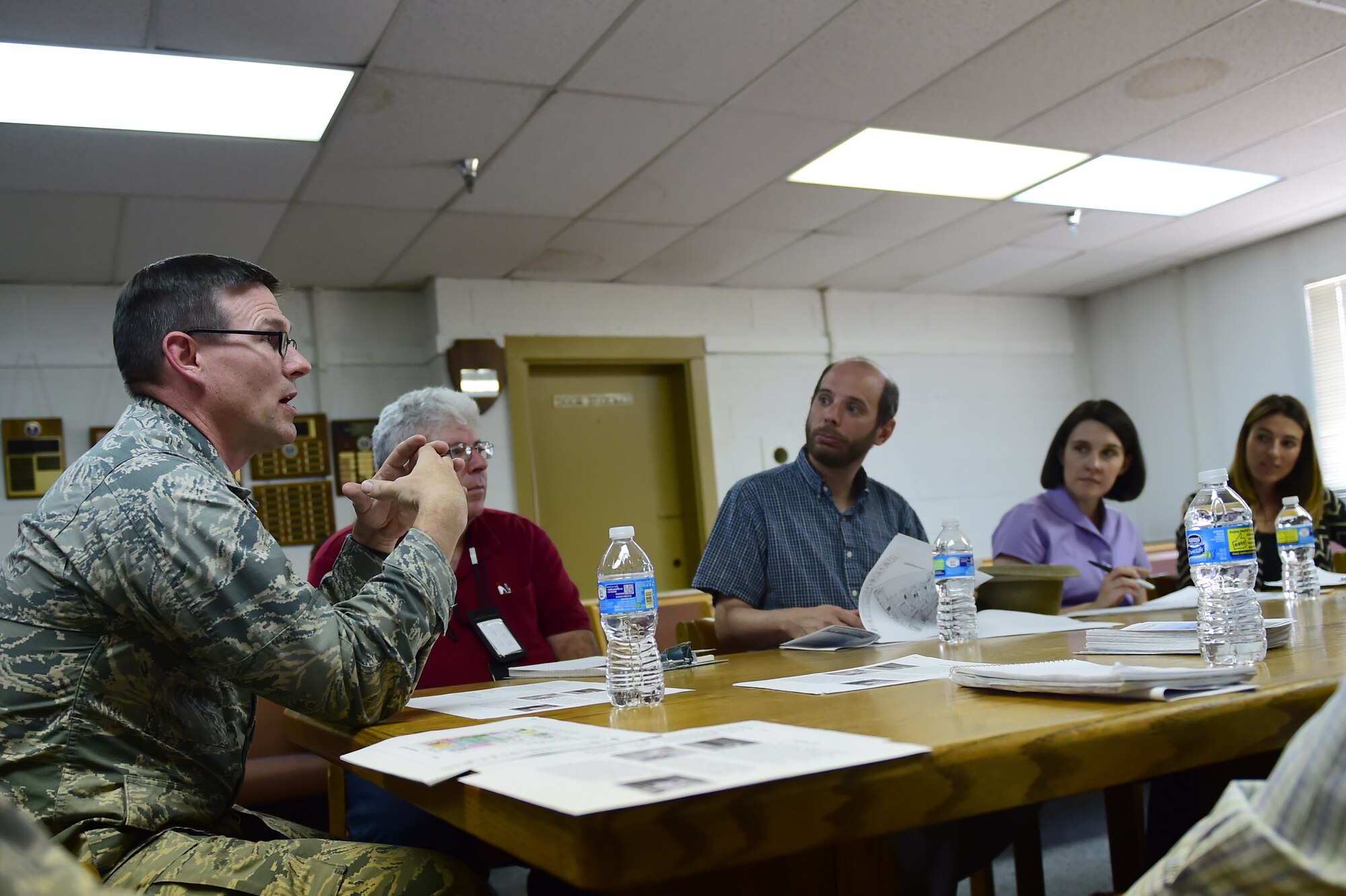 Lt. Col. William Smith, 140th Civil Engineer Squadron base civil engineer, briefs preservationists from Colorado organizations before a tour of Hangar 909 Sept. 14, 2015, on Buckley Air Force Base, Colo. Hangar 909 is being refurbished due to its deteriorating infrastructure. The project is set to begin in September 2016 and will not only improve the hangar’s structural integrity, and also enhance it to be able to support F-16 Fighting Falcon simulators for training purposes. (U.S. Air Force photo by Airman 1st Class Luke W. Nowakowski/Released)