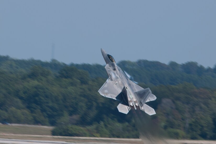 A U.S. Air Force F-22 Raptor fighter aircraft performs during an air show rehearsal Sept. 18, 2015 at Joint Base Andrews, Md. The F-22, part of the F-22 Demonstration Team, will participate in the 2015 JBA Air Show, Sept. 19, 2015. (U.S. Air Force photo by Senior Airman Dylan Nuckolls/Released)