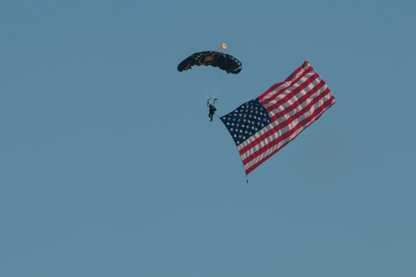 A member of the U.S. Special Operations Command Parachute Team parachutes during an air show rehearsal Sept. 18, 2015 at Joint Base Andrews, Md. The SOC Parachute Team will participate in the 2015 JBA Air Show, Sept. 19, 2015. (U.S. Air Force photo by Senior Airman Dylan Nuckolls/Released)