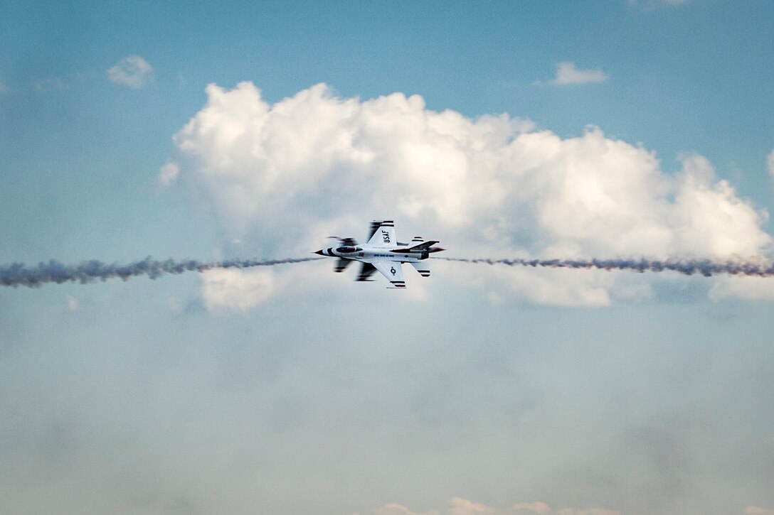 U.S. Air Force Thunderbirds perform during the rehearsal day prior to the 2015 Andrews Air Show at Joint Base Andrews, Md., Sept. 18, 2015. The Thunderbirds will be the headlining performers for the 2015 AAS on Sept. 19, 2015. (U.S. Air Force photo/Airman 1st Class Ryan J. Sonnier)