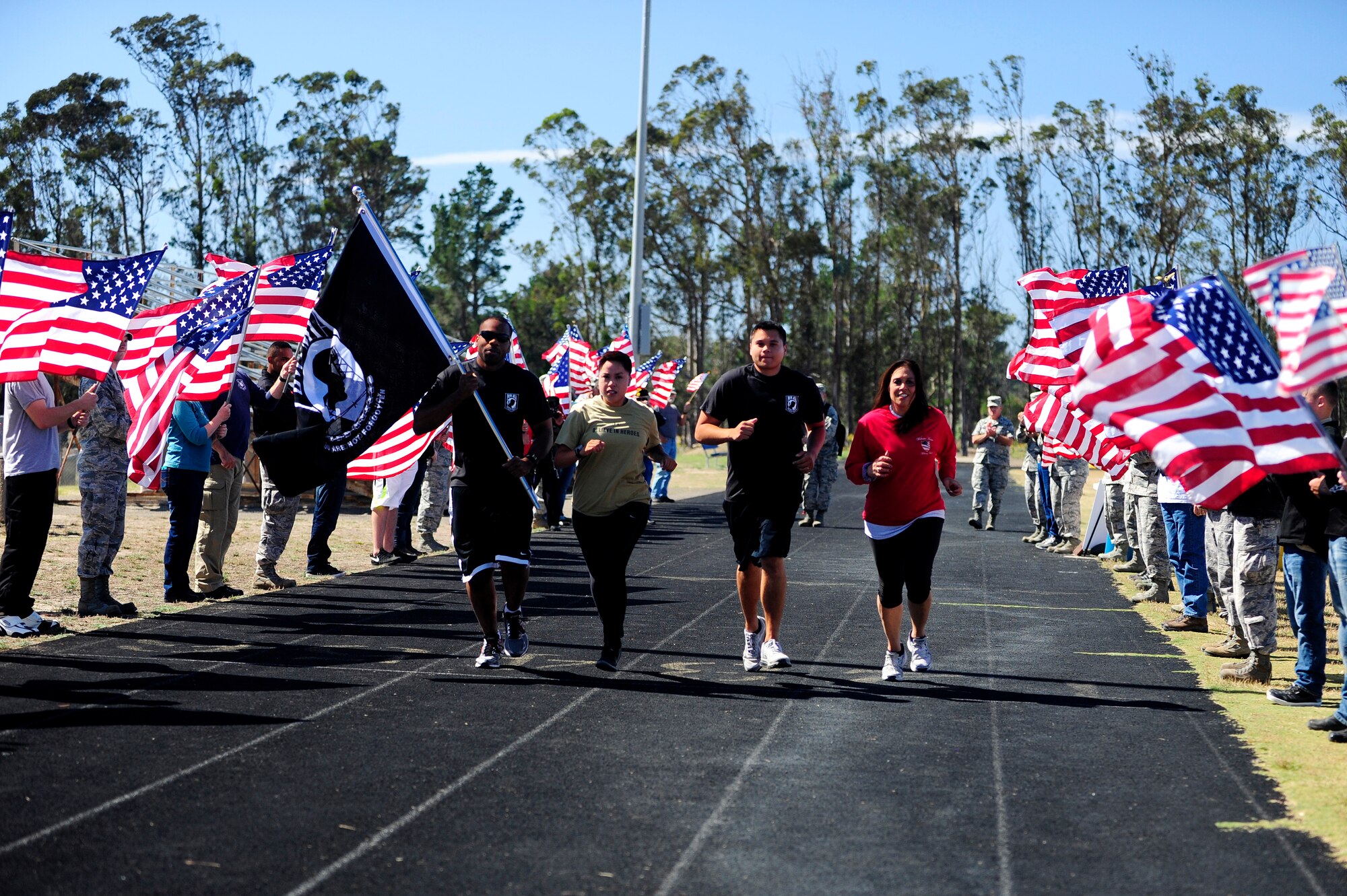 Vandenberg Airmen run during the Prisoner of War/Missing in Action 24-hour run, Sept. 17, 2015, Vandenberg Air Force Base, Calif. The POW/MIA run commemorates the men and women of the armed forces who gave immense sacrifices while in service. (U.S. Air Force photo by Staff Sgt. Jim Araos/Released)