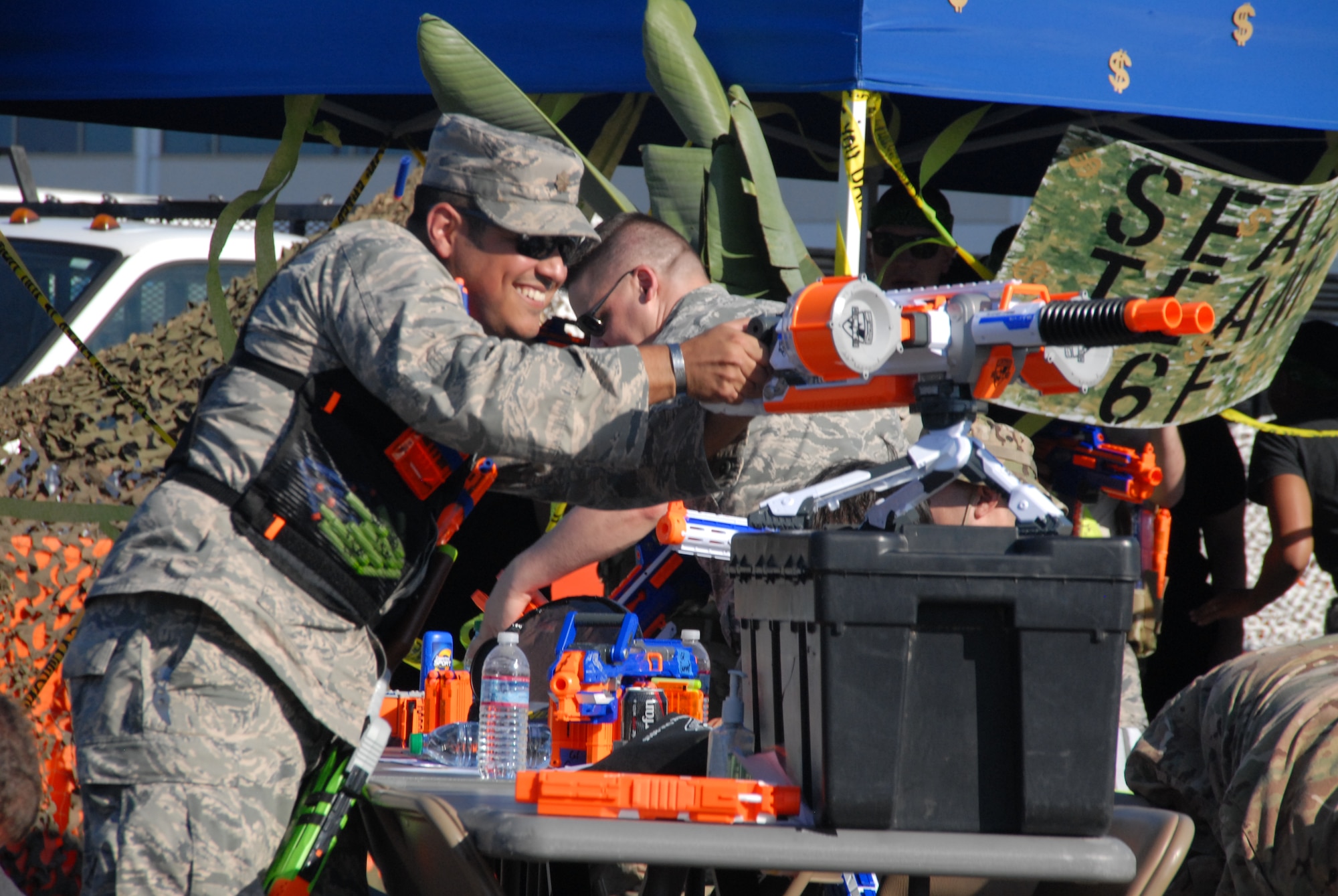 In deference to severe drought conditions in California, NERF weaponry of various sizes, shapes, and firepower were creatively pressed into action in lieu of water guns or balloons for mock “Code Red” attacks on the encampment during the Space and Missile Systems Center Dining-Out at Los Angeles Air Force Base in El Segundo, Calif. (U.S. Air Force photo/Jim Spellman)