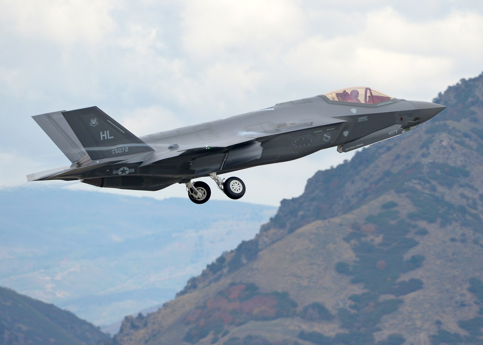 34th Fighter Squadron Assistant Director of Operations Maj. Brad Matherne, retracts his landing gear after taking off from Hill Air Force Base, Utah, Sept. 17, during one of the base’s first sorties with the recently acquired, combat-coded F-35A Lightning II aircraft. Along with 34th Fighter Squadron Commander Lt. Col. George Watkins in another F35A, Matherne conducted mission qualification training, focusing on weapons employment, range familiarization and mission system proficiency. (U.S. Air Force photo/Alex R. Lloyd)