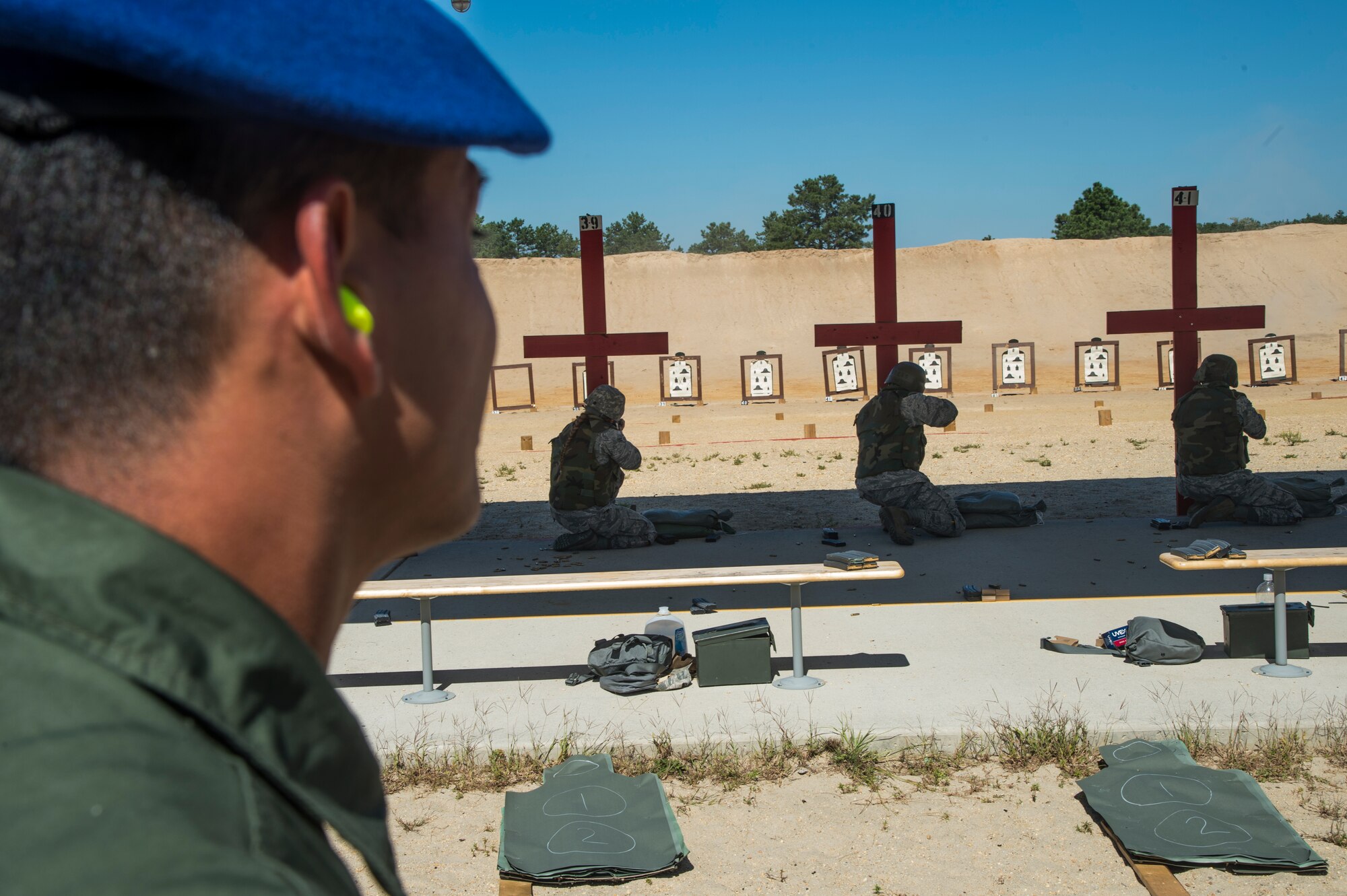 Tunisian Air Force 1st Lieutenant Ousji Achraf watches Airmen from the 621st Contingency Response Wing conduct their weapons qualifications during their visit at Joint Base McGuire-Dix-Lakehurst, N.J., Sept. 15, 2016. The weeklong engagement focused on sharing ideas and experiences in the realm of airbase defense. Engaging with partner nations in air mobility operations helps increase the capacity to move to locations where
partner nations are interested in improving humanitarian assistance/disaster relief, regional stability and peacekeeping operations. (U.S. Air Force photo by Staff Sgt. Gustavo Gonzalez)