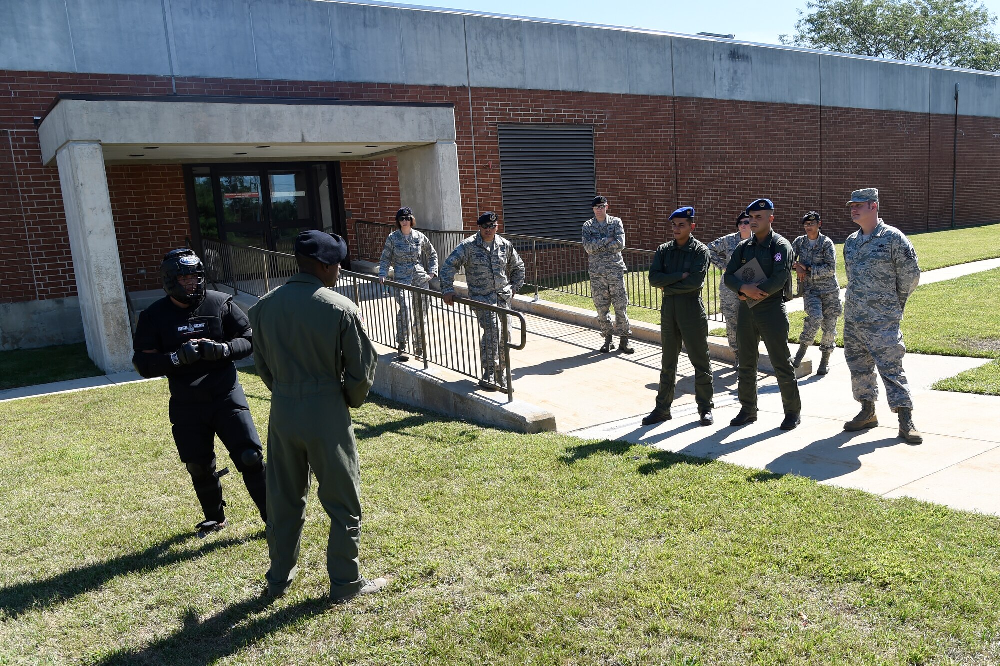 U.S. Air Force Expeditionary Center Ravens conduct a demonstration for two Tunisian Airmen during their visit at Joint Base McGuire-Dix-Lakehurst, N.J., Sept. 15, 2016. The weeklong engagement focused on sharing ideas and experiences in the realm of airbase defense. The MSAS conducts building partnership engagements and play an essential role in establishing and maintaining relationships with strategic partner nations. (U.S. Air Force photo by Staff Sgt. Gustavo Gonzalez)
