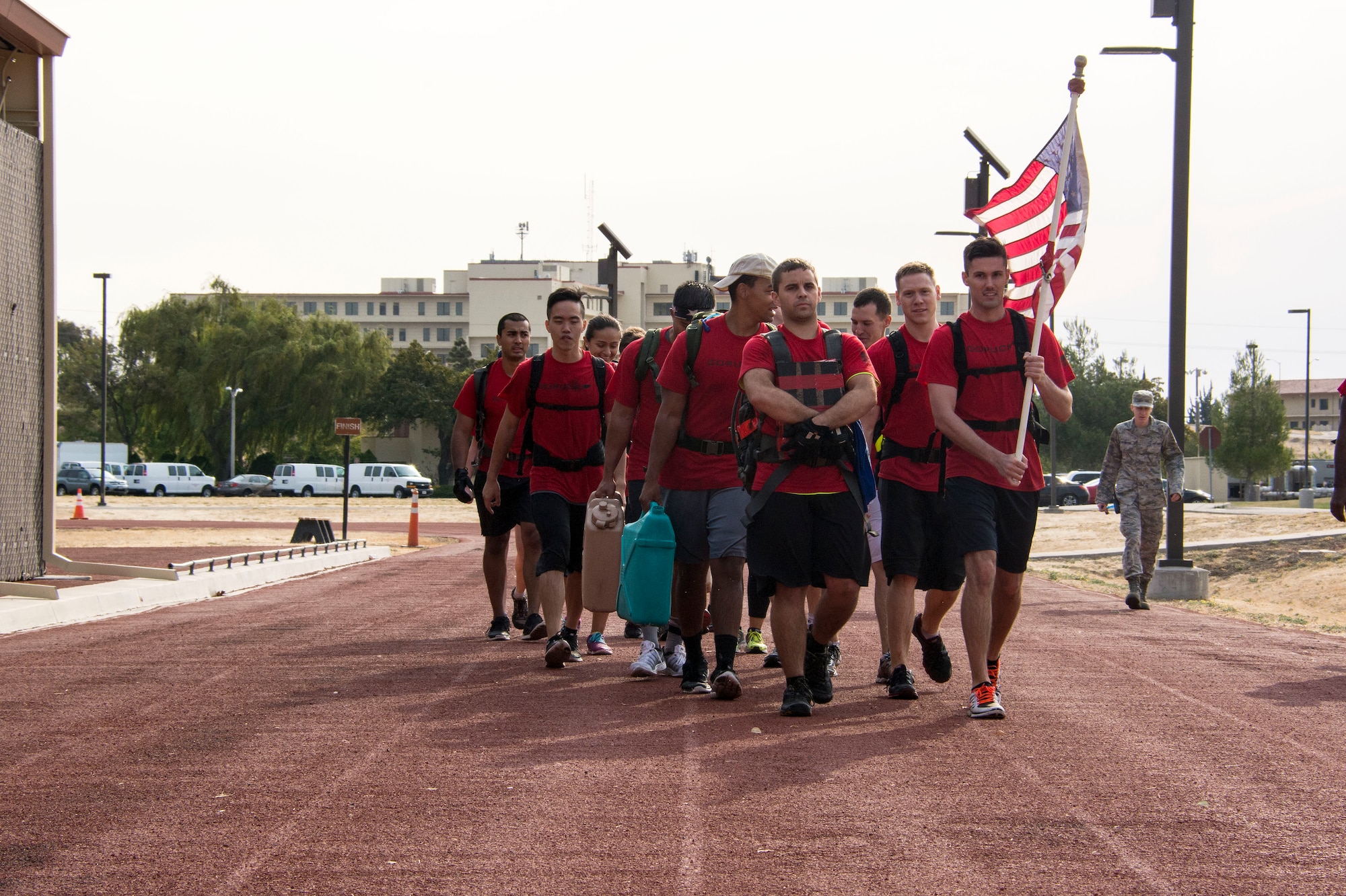 Sixteen participants took part in a GoRuck Light Challenge Sept. 12, 2015, at Travis Air Force Base, California. For nearly six hours participants dragged tractor-sized tires, overhead carried river rafts, completed rigorous body-weight based exercises and rucked more seven miles. (U.S. Air Force photo/Senior Airman Charles Rivezzo)