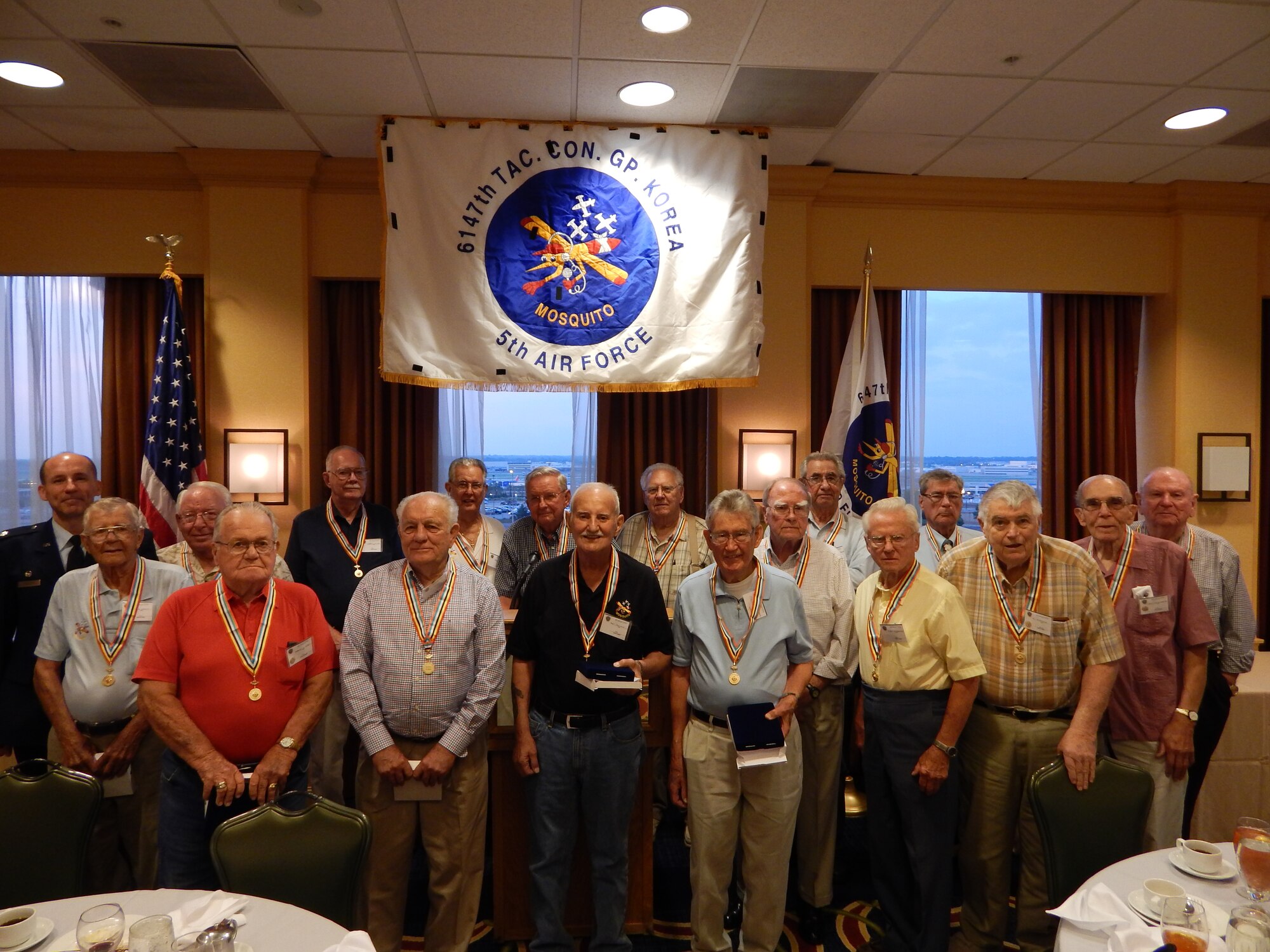 The 6147th Tactical Control Group hosted a reunion banquet Sept. 4 in St. Louis and surprised eighteen of its members by presenting them with the Korean Ambassador for Peace Medal. (U.S. Air Force photo/Christine Spargur)