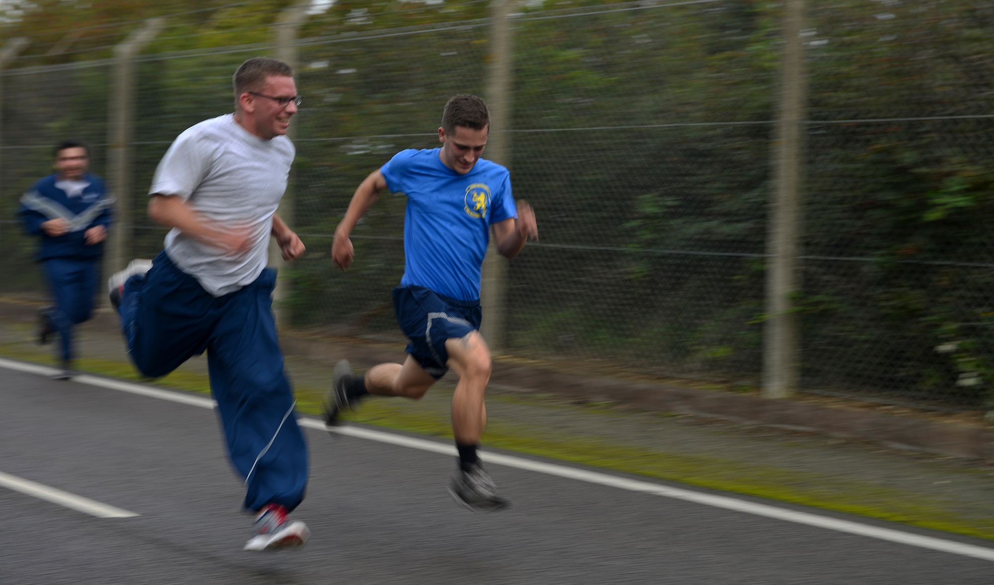 Team Mildenhall Airmen run for the finish line Sept. 18, 2015, on RAF Mildenhall, England. The run encourages morale and camaraderie throughout the base through exercise and healthy competition. (U.S. Air Force photo by Staff Sgt. Micaiah Anthony/Released)