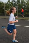 U.S. Air Force 1st Lt. Victoria Hagan, 100th Force Support Squadron manpower and personnel flight commander, runs for the finish line Sept. 18, 2015, on RAF Mildenhall, England. Hagan was the second female to finish the run. (U.S. Air Force photo by Staff Sgt. Micaiah Anthony/Released)