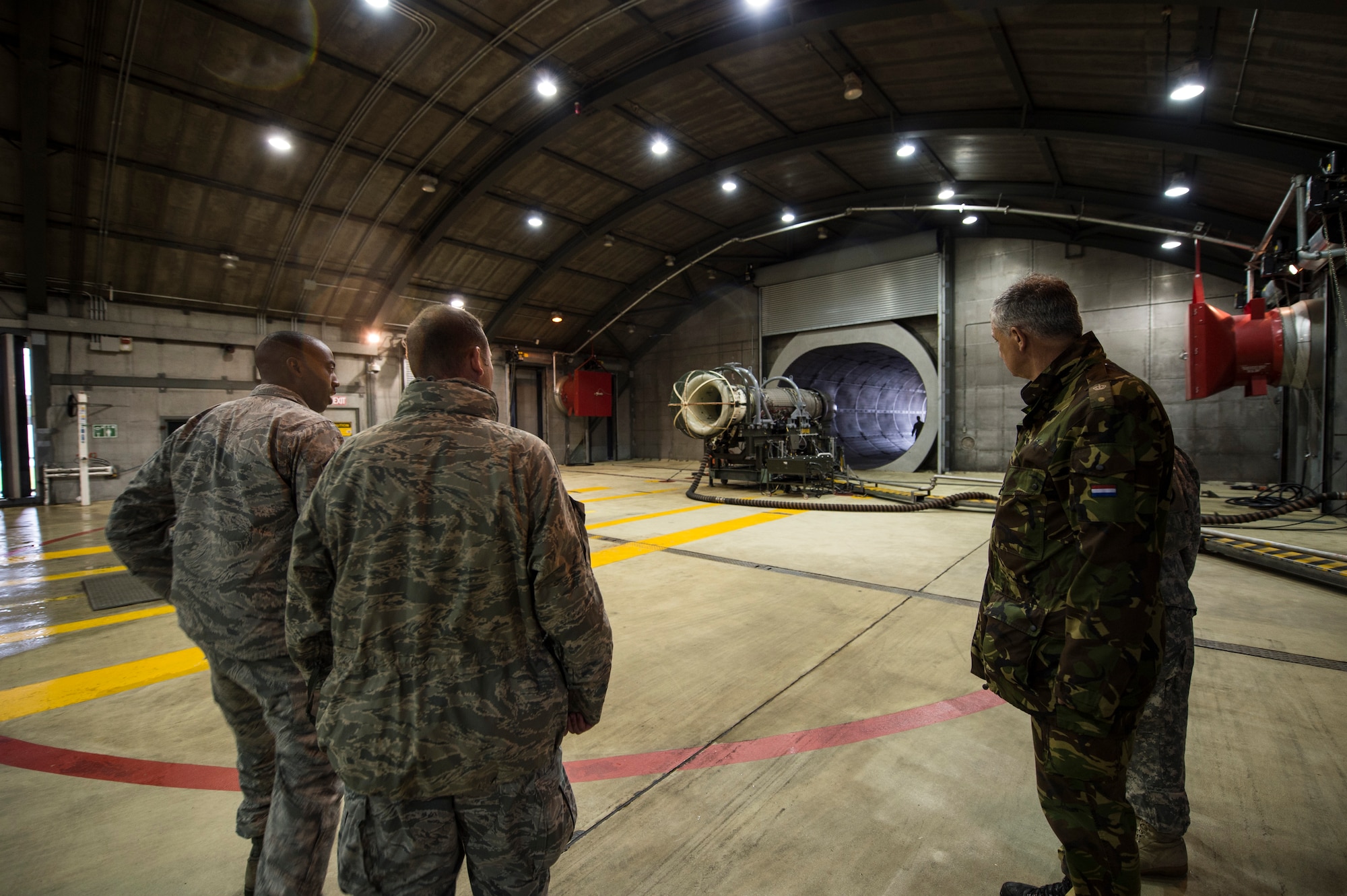 Inspectors from the Conventional Armed Forces in Europe treaty verification team walk through the propulsion flight engine testing facility during an exercise at Spangdahlem Air Base, Germany, Sept. 16, 2015. The inspectors visited the base as part of an exercise hosted by the 52nd Fighter Wing. The U.S. Air Force invited service members from Luxembourg, Belgium, Netherlands and Germany to take part in the inspection exercise as the treaty verification team. The inspectors determined the U.S. Air Force’s compliance with CFE treaty regulations. (U.S. Air Force photo by Staff Sgt. Christopher Ruano/Released)