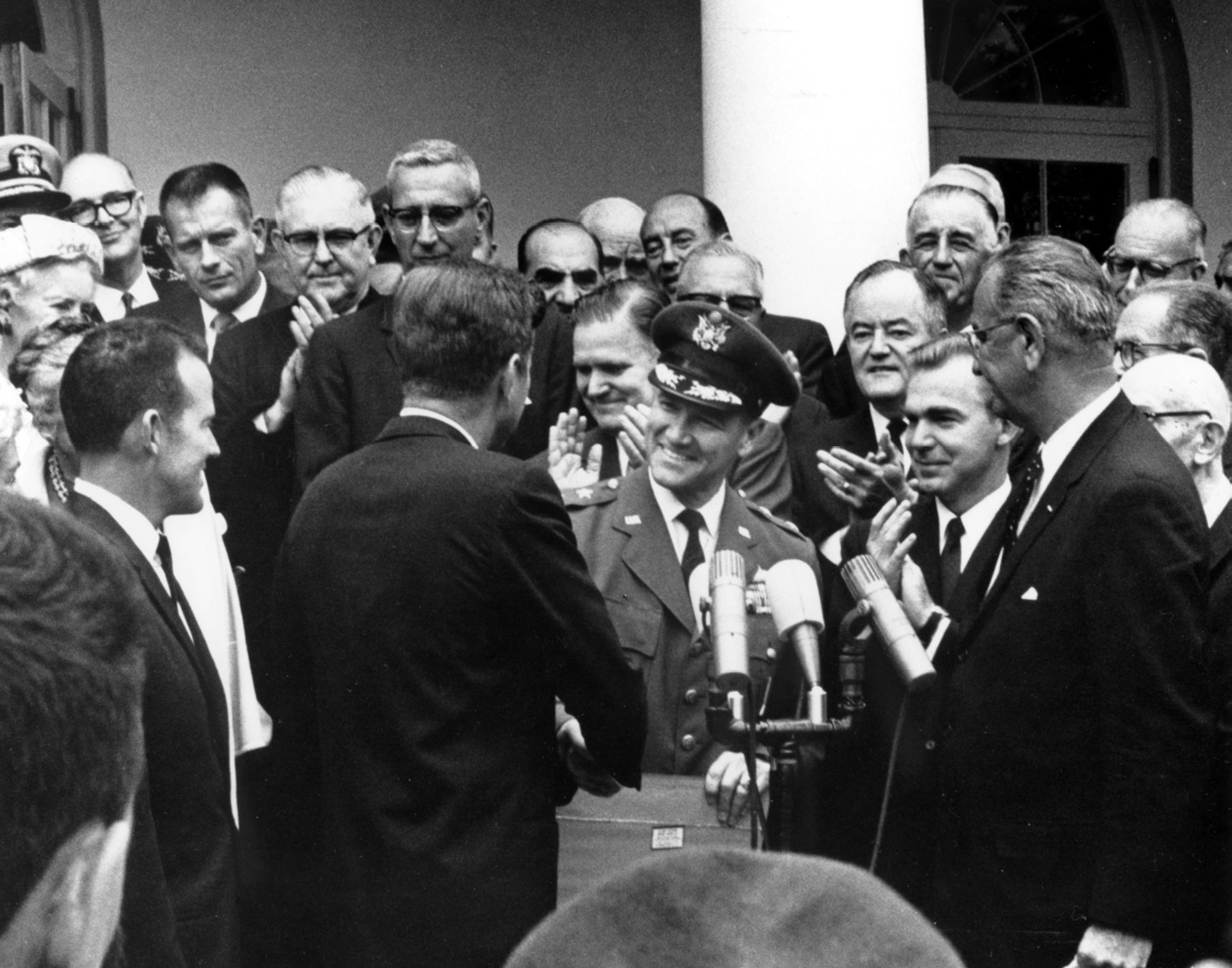 President John F. Kennedy presents Maj. Gen. Ben I. Funk with NASA's Space Achievement Award in a Rose Garden ceremony at the White House in 1963 as Mercury astronaut and Air Force Maj. Gordon Cooper, left, and vice president Lyndon B. Johnson, right, look on. Also recognizable in the photo are Mercury astronaut and Air Force Maj. Donald K. Deke Slayton, directly above Cooper, NASA Administrator James Webb, behind and to the left of Gen. Funk, and Senator Hubert H. Humphrey, behind and to the right of Gen. Funk. (U.S. Air Force photo)