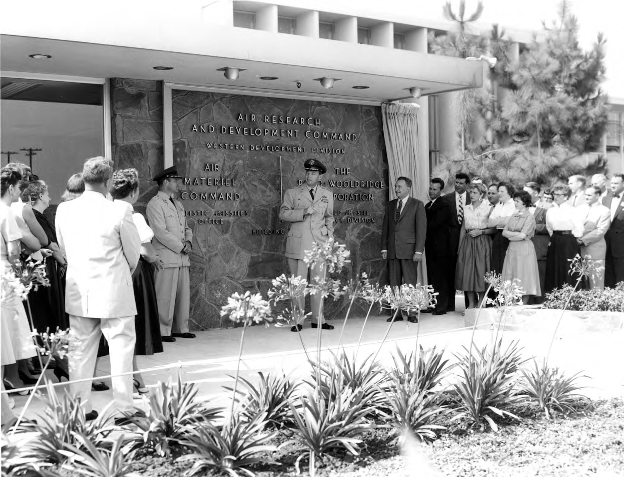Then-Maj..Gen. Bernard Schriever presides over the new Western Development Division facility on Arbor Vitae Blvd. in Inglewood, Calif. in 1956. Dr. Simon Ramo of the Ramo-Wooldridge Corporation is to Gen. Schriever's left. (U.S. Air Force photo)