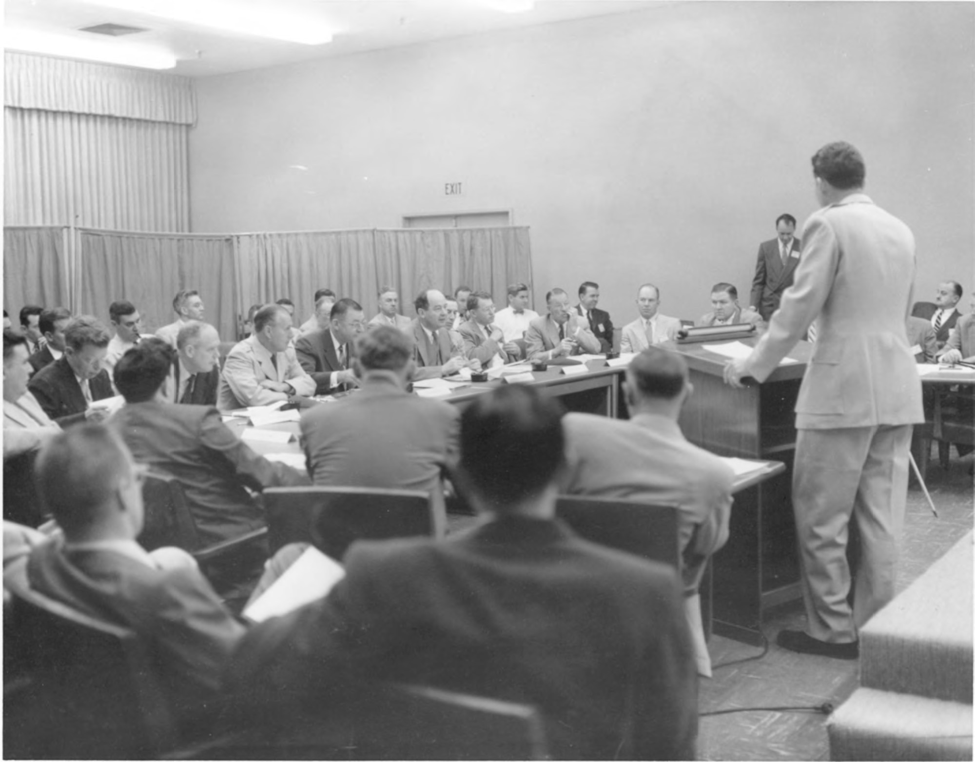 Then-Brig. Gen. Bernard Schriever address a session of the Von Neumann Committee at the Western Development Division's Arbor Vitae Complex in Inglewood, Calif. in the fall of 1955. The Committee had been reconstituted as the Atlas Scientific Advisory Committee. Facing Gen. Schriever in the front row (left to right) are George McRae of Sandia Corporation, aviation legend Charles Lindbergh, Gen. Thomas Power, commander of the Air Research and Development Command, Assistant Secretary of the Air Force Trevor Gardner, Committee Chairman John von Neumann, Col. Harold Norton, H. Guyford Stever of MIT and Clark Millikan of Caltech (U.S. Air Force photo)