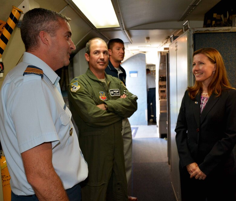 Canadian Consul General Sara Wilshaw, right, receives a tour of an E-3 “Sentry” Airborne Warning and Control System aircraft by Lt. Col. Donald Saunders, 552nd Air Control Wing Canadian Detachment commander, left, and Col. David Gaedecke, 552nd ACW commander, shortly after her arrival to the base here Monday afternoon. During her brief visit, Ms. Wilshaw also presented the Canadian Forces Decoration for longevity to Maj. Mike Wiseman and Capt. Jennifer Campbell, and participated in a roundtable discussion with about 30 members of the Canadian Detachment. The decoration is awarded to members of the Canadian Forces who have completed 12 years of service. Ms. Wilshaw serves as the Consul General of Canada to the South Central United States, which is based in Dallas and consists of Arkansas, Louisiana, New Mexico, Oklahoma and Texas. In a message from the Consul General, Ms. Wilshaw said, “We defend North America together. At Tinker Air Force Base, 43 members of the Royal Canadian Air Force and Canadian Army form the Canadian Component. For 35 years, Canadians have been an integral part of the North American Aerospace Defense Command’s [AWACS] program, deploying in North American skies and around the globe. And, we’re building North America’s energy security together.” (Air Force photo by Darren D. Heusel/Released)