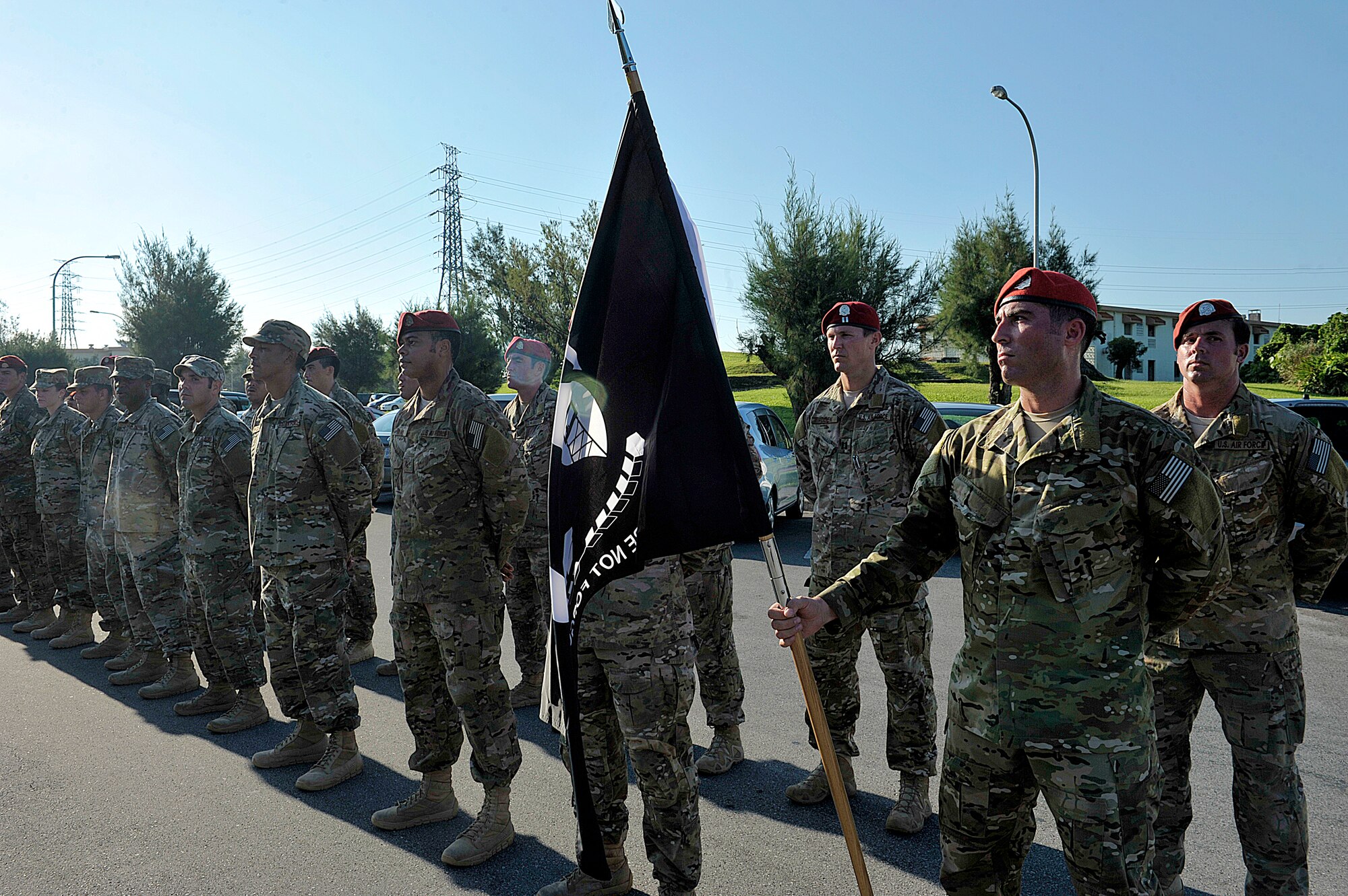 Airmen from the 320th Special Tactics Squadron stand in formation prior to the POW/MIA remembrance breakfast held at the Officers’ Club Sept. 18, 2015, on Kadena Air Base, Japan. During the 24-hour vigil run, units from around the base carried the flag in honor of U.S. service members who were prisoners of war or missing in action. (U.S. Air Force photo by Naoto Anazawa)