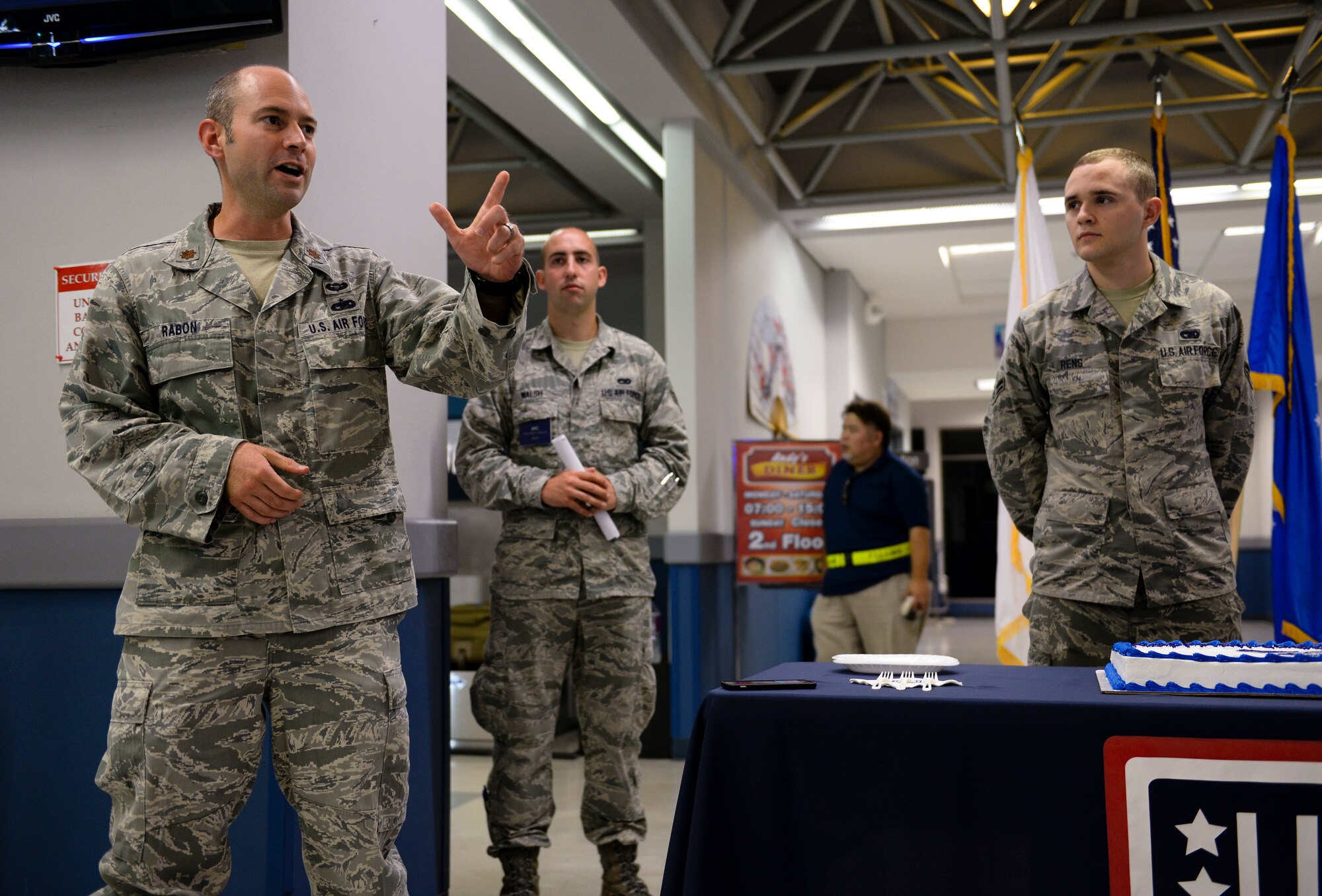 U.S. Air Force Maj. Bob Rabon, 733rd Air Mobility Squadron acting commander, shares a few words in honor of the Air Force’s 68th birthday, Sept. 18, 2015, at the Kadena Air Base Passenger Terminal, Japan. Members from the 733rd AMS and volunteers from USO Kadena hosted a cake cutting ceremony to celebrate the occasion. Travelers passing through the terminal were also invited to partake in the observance.  (U.S. Air Force photo by Senior Airman John Linzmeier)