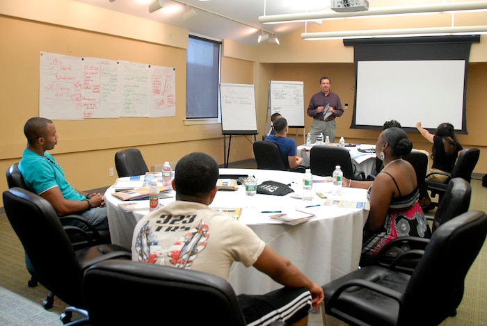Lt. Col. James D. Buckman, a 108th Wing chaplain, instructs single Airmen during the Strong Bonds retreat at the Chauncey Hotel and Conference Center in Princeton, N.J., Aug. 2_, 2015. Strong Bonds is a chaplain based military program designed to assist commanders in supporting unit-led retreats for service members, their spouses and their families. The programs taught are research based in the hopes of building resiliency and reduces stressors that can endanger Airmen. The 108th Wing chaplain’s office hosts four Strong Bonds events every year. (U.S. Air National Guard photo by Airman 1st Class Julia Pyun/Released)