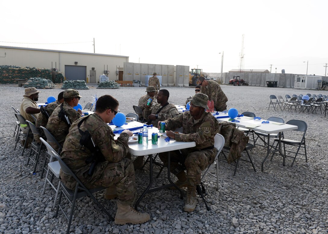 U.S. Airmen assigned to the 455th Air Expeditionary Wing gather at a block party held in honor of the Air Force’s 68th birthday Sept. 18. 2015, at Bagram Airfield, Afghanistan. The block party which was hosted by the Armed Forces Committed to Excellence council, the 455th Force Support Squadron and other private organizations featured games, food and a traditional AF cake cutting ceremony. (U.S. Air Force photo by Senior Airman Cierra Presentado/Released)