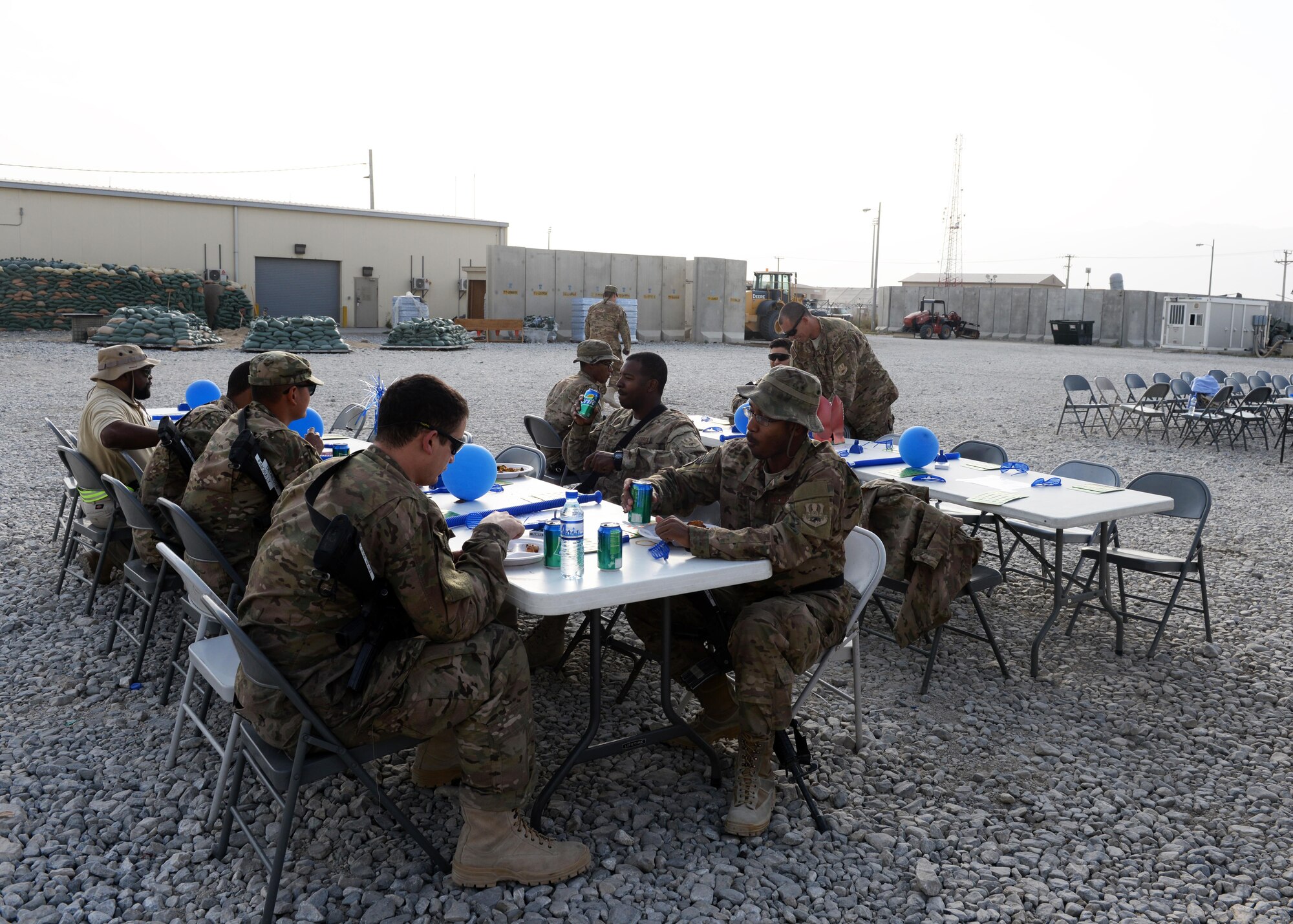 U.S. Airmen assigned to the 455th Air Expeditionary Wing gather at a block party held in honor of the Air Force’s 68th birthday Sept. 18. 2015, at Bagram Airfield, Afghanistan. The block party which was hosted by the Armed Forces Committed to Excellence council, the 455th Force Support Squadron and other private organizations featured games, food and a traditional AF cake cutting ceremony. (U.S. Air Force photo by Senior Airman Cierra Presentado/Released)