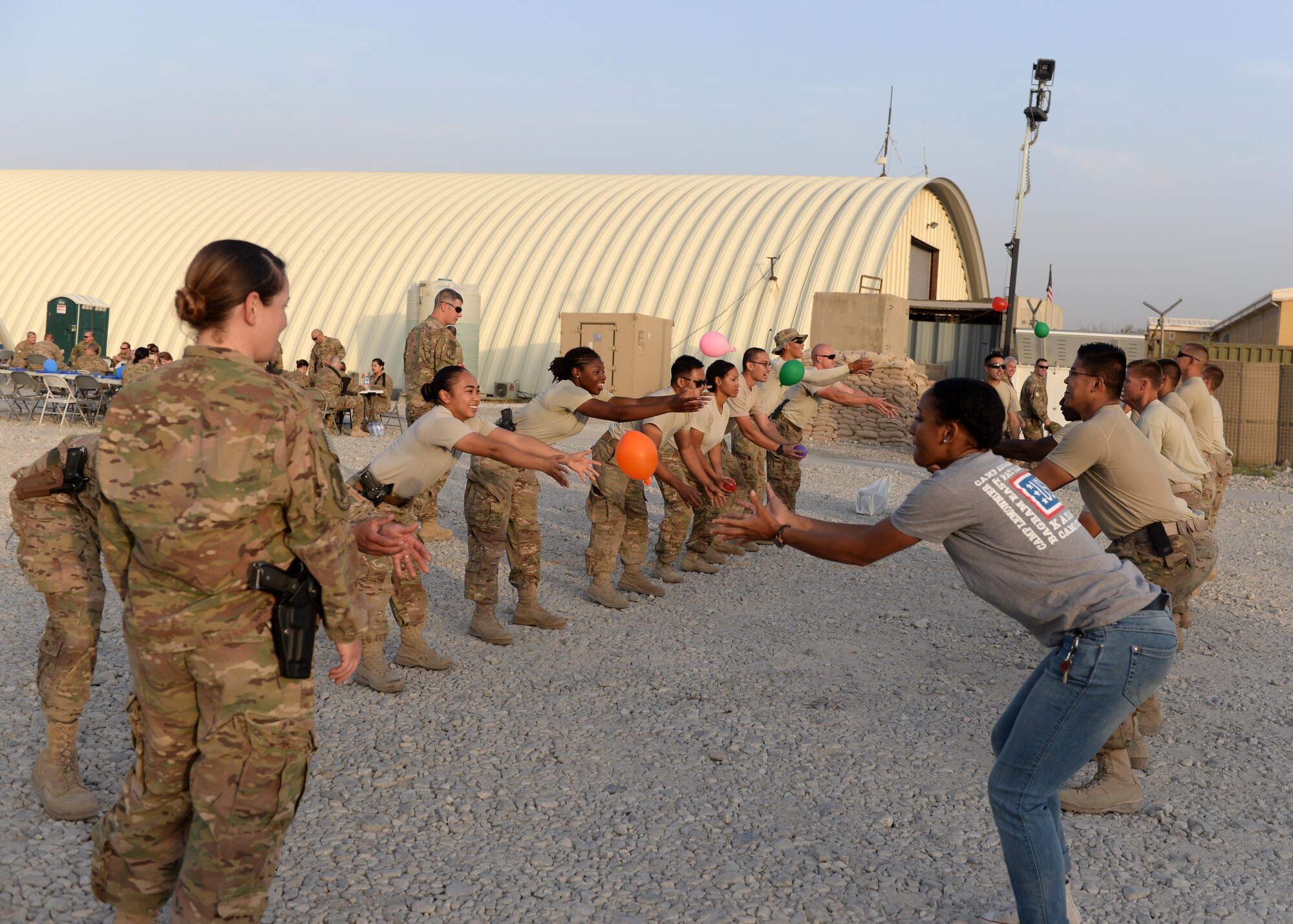 U.S. Airmen assigned to the 455th Air Expeditionary Wing participate in games during an Air Force birthday celebration Sept. 18, 2015, at Bagram Airfield, Afghanistan. The block party which was hosted by the Armed Forces Committed to Excellence council, the 455th Force Support Squadron and other private organizations featured games, food and a traditional AF cake cutting ceremony. (U.S. Air Force photo by Senior Airman Cierra Presentado/Released)