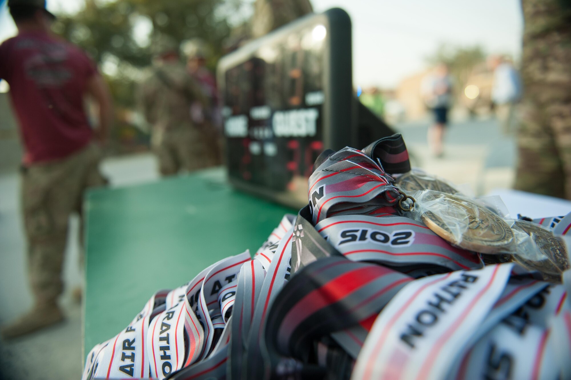 Medals sit on a table before being handed out to Air Force Marathon participants at Bagram Airfield, Afghanistan, Sept. 19, 2015. This year marked the 7th year that the AF has sanctioned deployed location races overseas. (U.S. Air Force photo by Tech. Sgt. Joseph Swafford/Released)