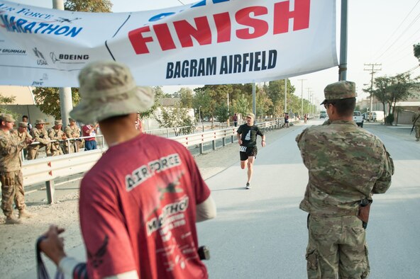 U.S. Air Force Lt. Col. William Poteet, 455th Expeditionary Operation Group deputy commander, completes the Air Force Marathon at Bagram Airfield, Afghanistan, Sept. 19, 2015. This year marked the 7th year that the AF has sanctioned deployed location races overseas. (U.S. Air Force photo by Tech. Sgt. Joseph Swafford/Released)