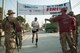 A Coalition partner assigned to Bagram Airfield completes the Air Force Marathon at Bagram Airfield, Afghanistan, Sept. 19, 2015. This year marked the 7th year that the AF has sanctioned deployed location races overseas. (U.S. Air Force photo by Tech. Sgt. Joseph Swafford/Released)