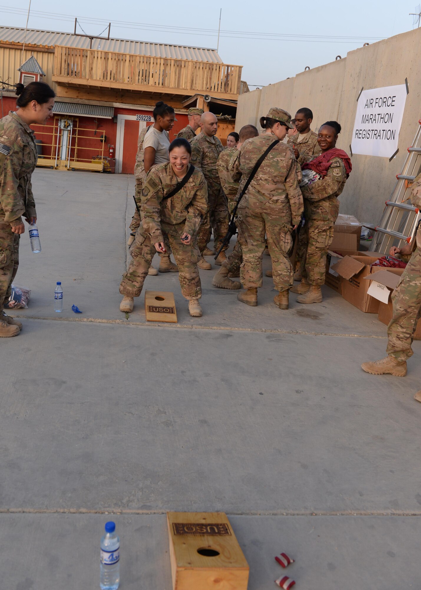U.S. Airmen assigned to the 455th Air Expeditionary Wing participate in a game of corn hole during an Air Force birthday celebration Sept. 18, 2015, at Bagram Airfield, Afghanistan. The celebration which was hosted by the Armed Forces Committed to Excellence council, the 455th Force Support Squadron and other private organizations featured games, food and an Air Force tradition cake cutting ceremony. (U.S. Air Force photo by Senior Airman Cierra Presentado/Released)