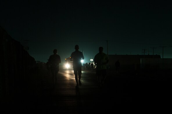 U.S. Service members run during the Air Force Marathon 10K event at BAF, Afghanistan, Sept. 19, 2015. This year marked the 7th year that the AF has sanctioned deployed location races overseas. (U.S. Air Force photo by Tech. Sgt. Joseph Swafford/Released)